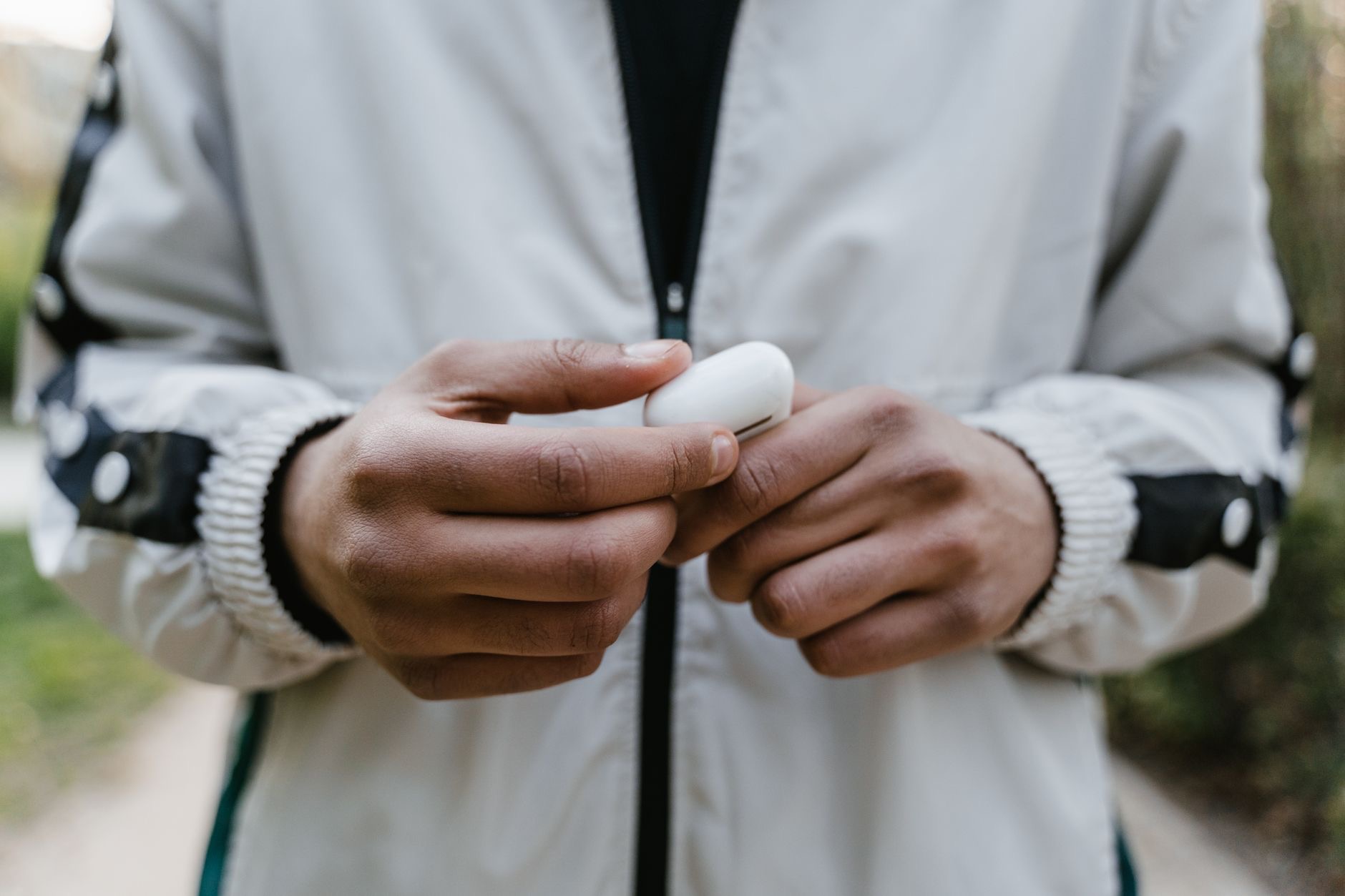 A person wearing wireless earbuds