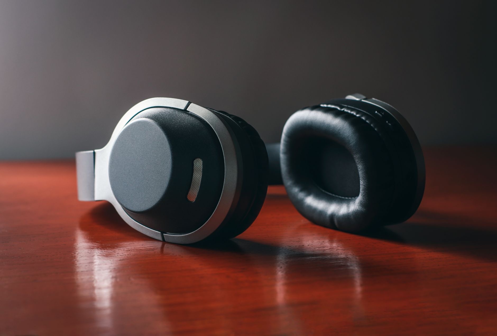 Over-ear headphones resting on a surface