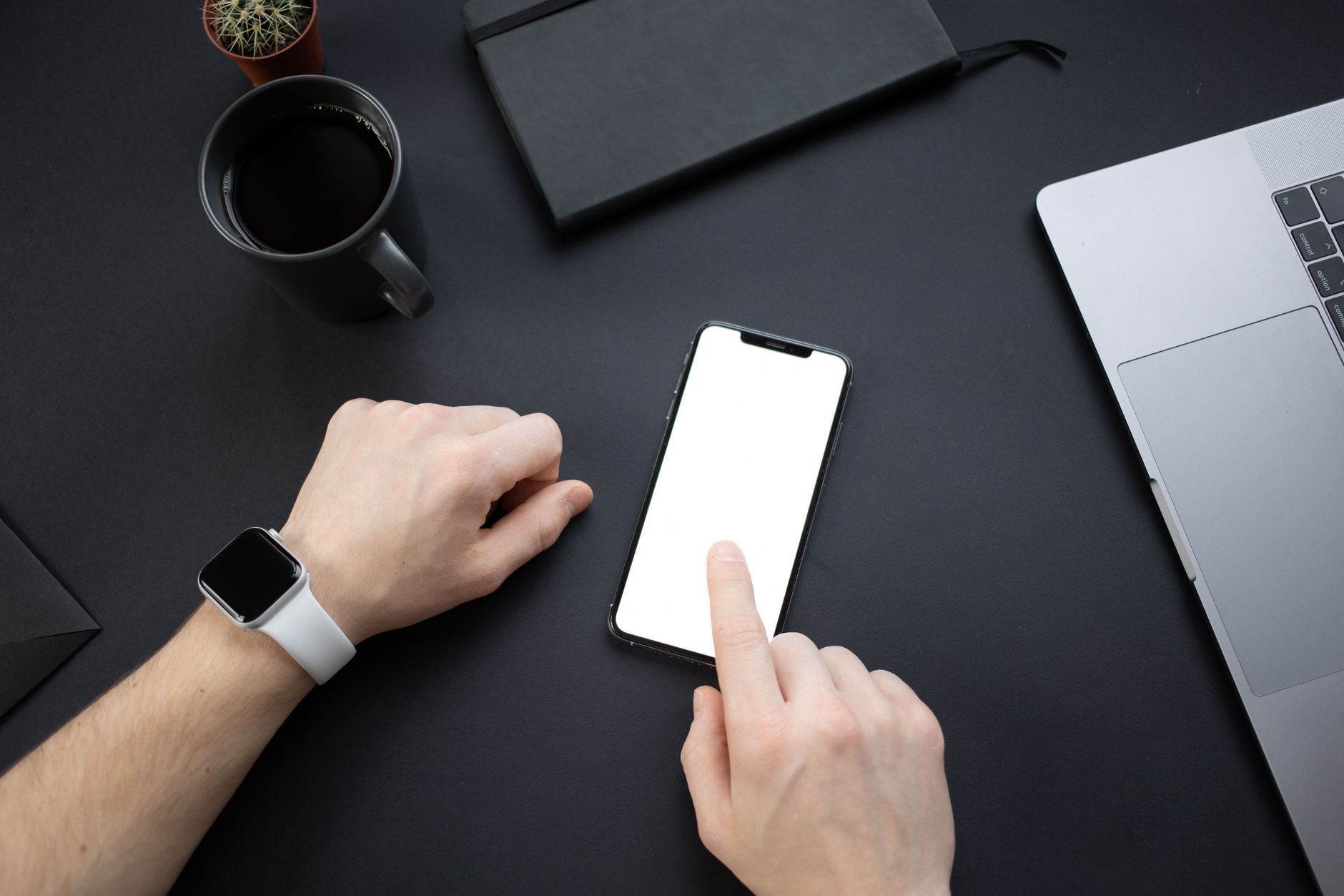 Smartwatch resting beside a smartphone