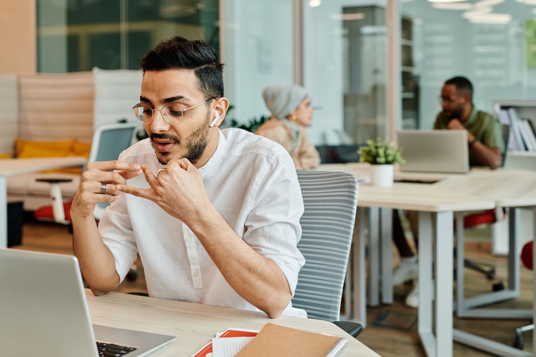 Person on a video meeting wearing earbuds