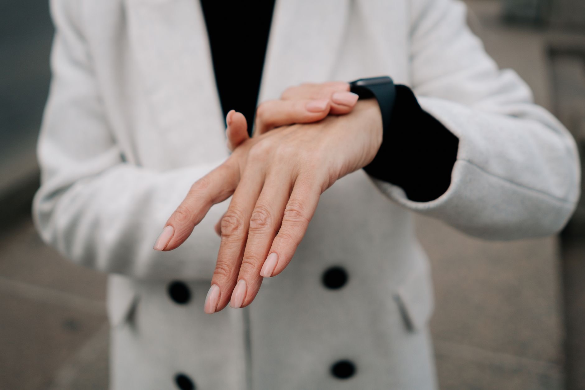 Person checking sleep data on a smartwatch