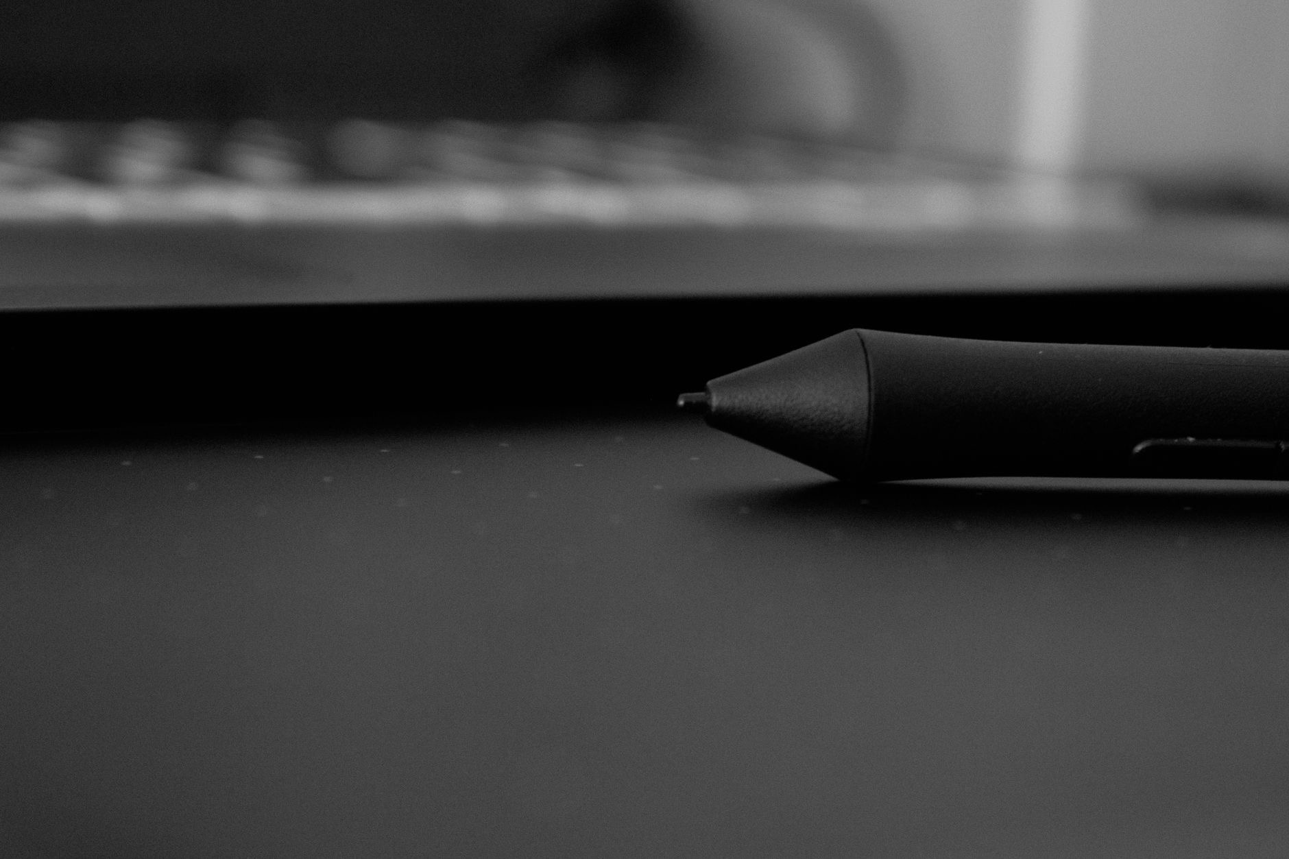 Stylus drawing on a tablet screen showing digital art