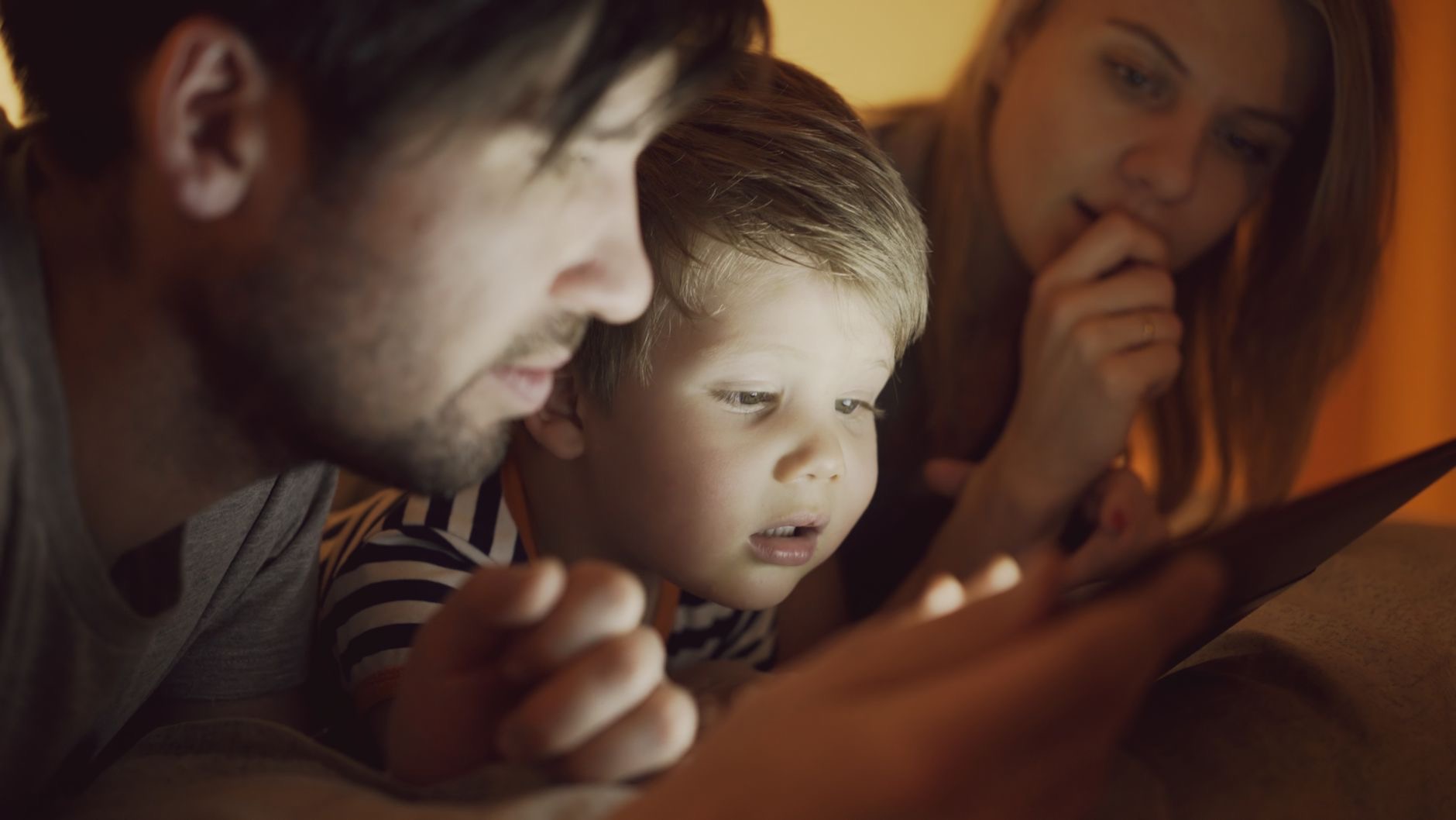 Parent and child using a tablet together