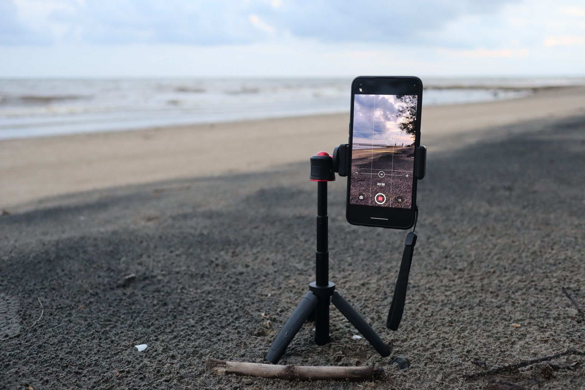 iPhone mounted on a tripod outdoors for landscape photography