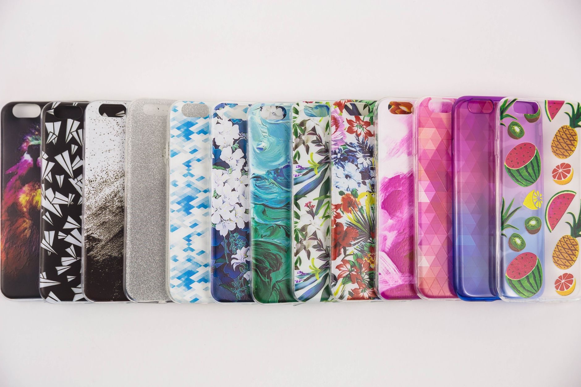 Colorful iPhone cases displayed on a white surface