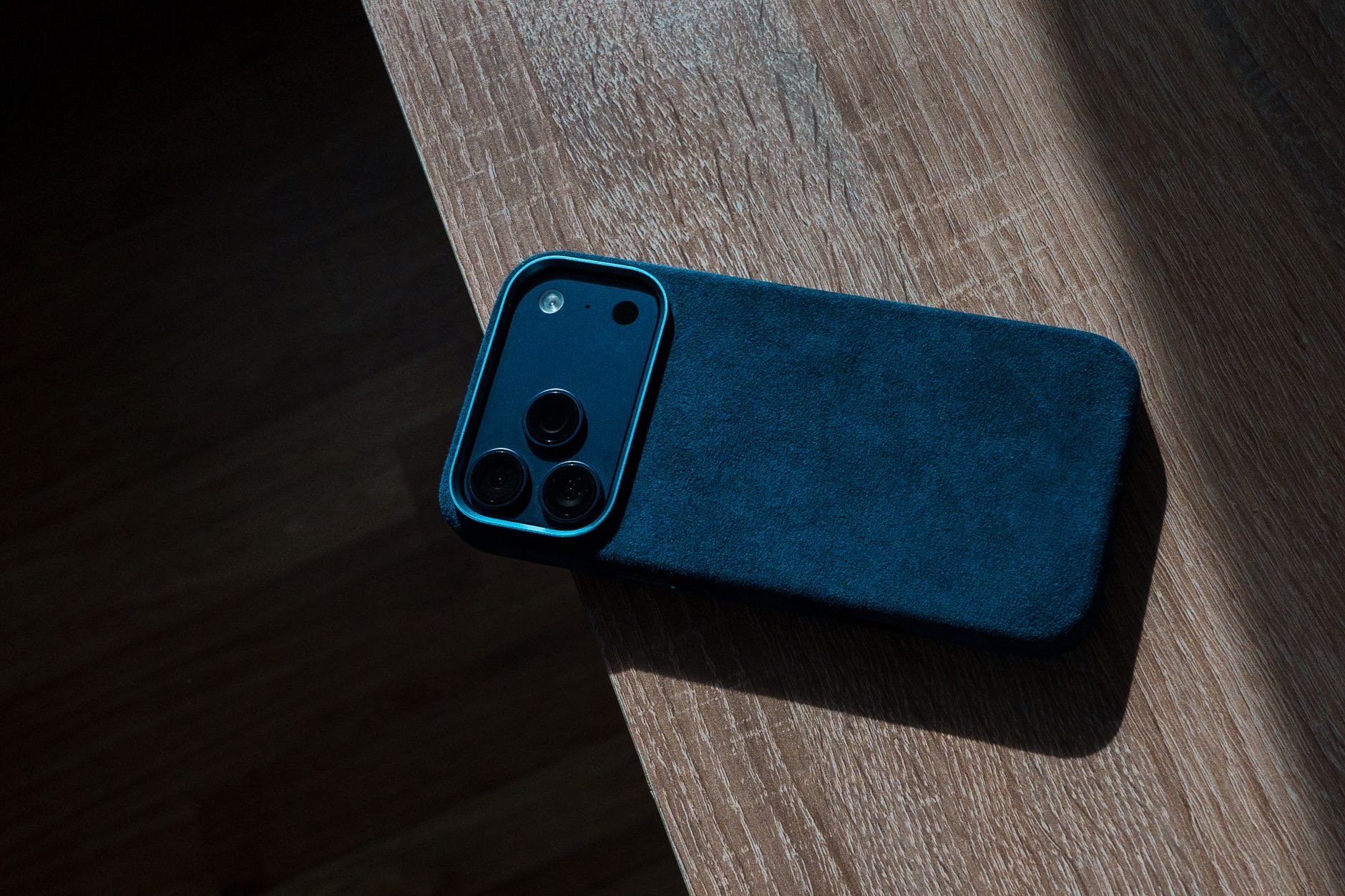 A smartphone with a protective case on a table