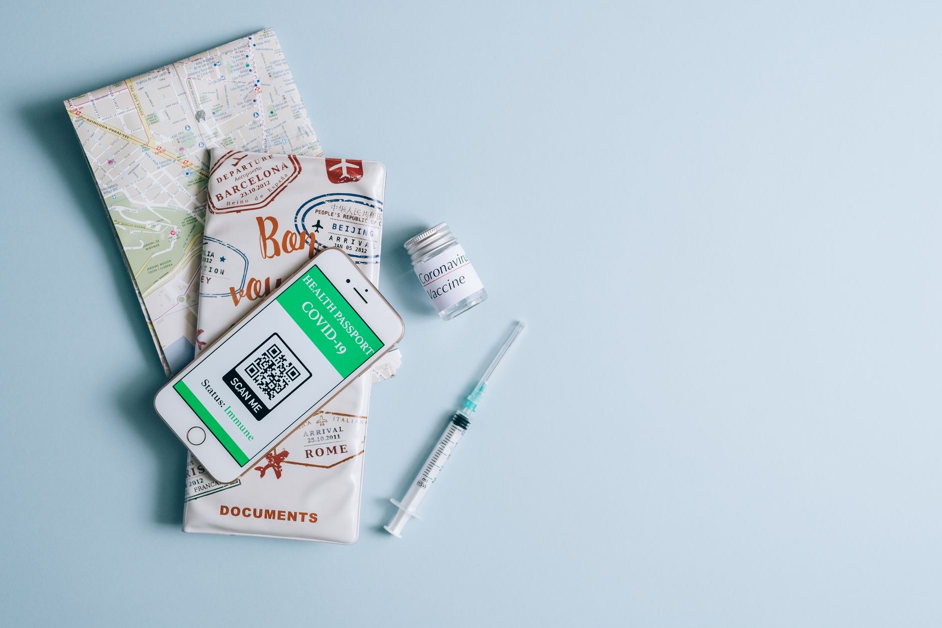 Smartphone with a map beside travel items