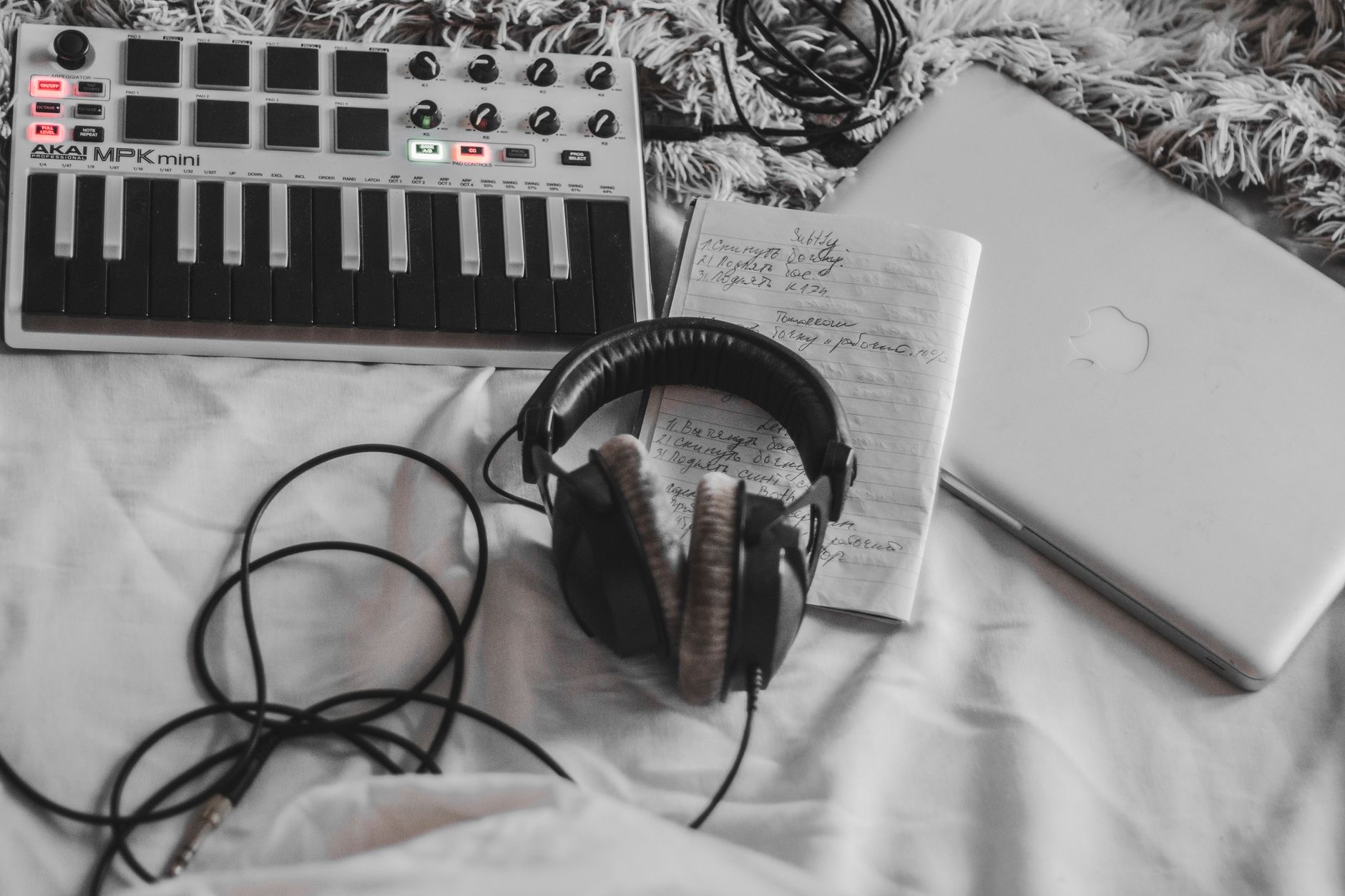 Producer working on a laptop with headphones