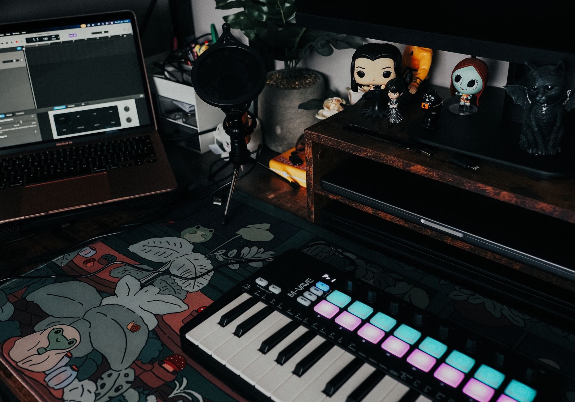 Audio interface and keyboard beside a computer