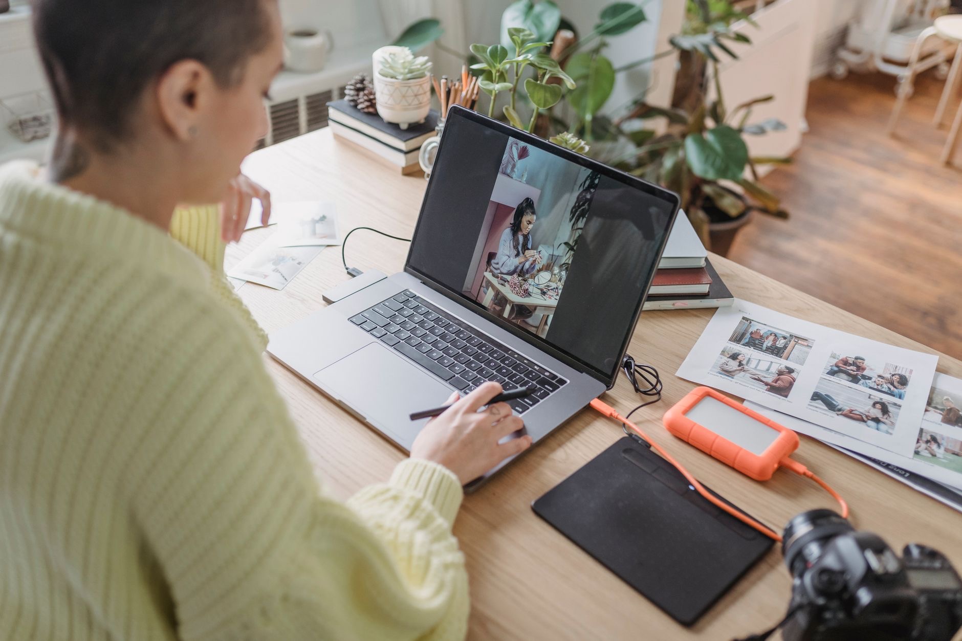 Photographer editing images on a laptop