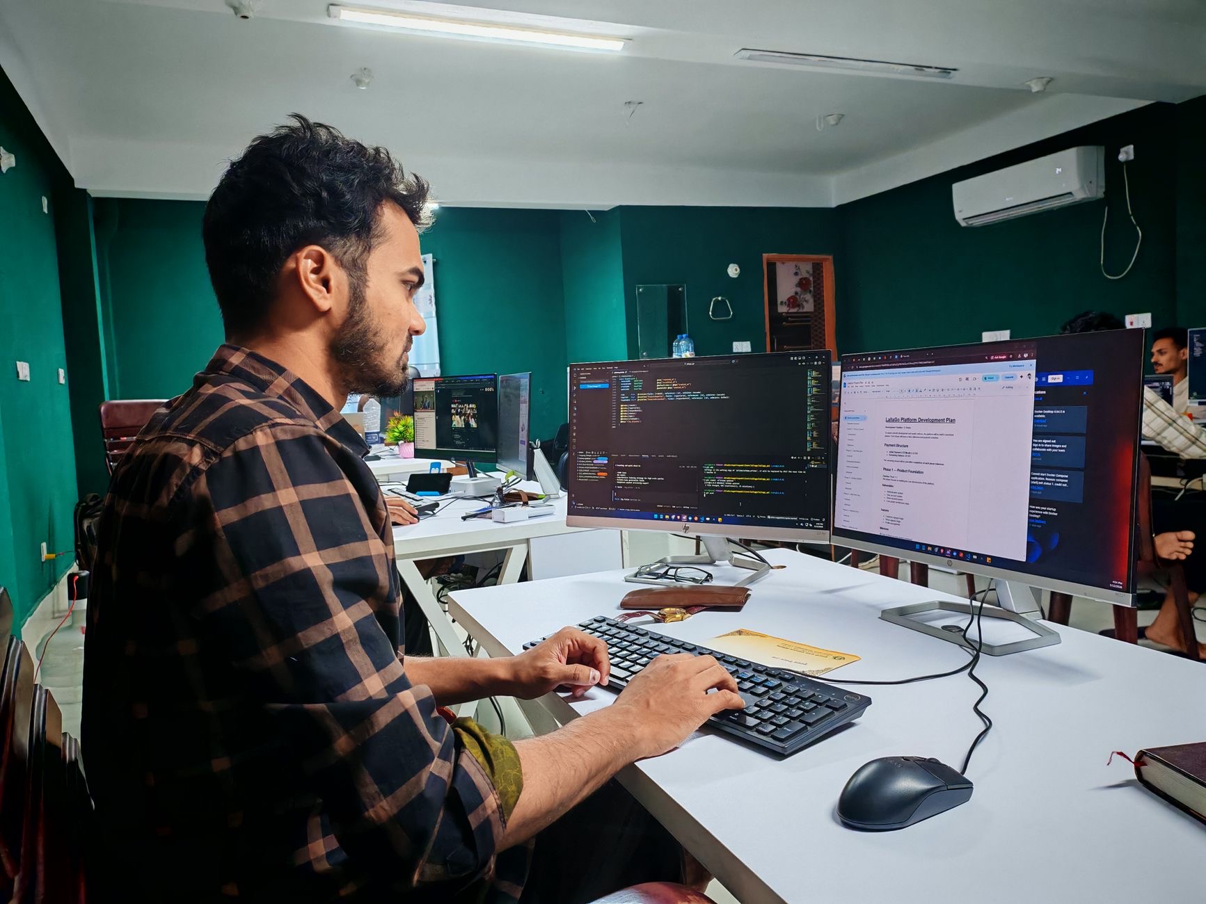 Software developer working at a desk setup