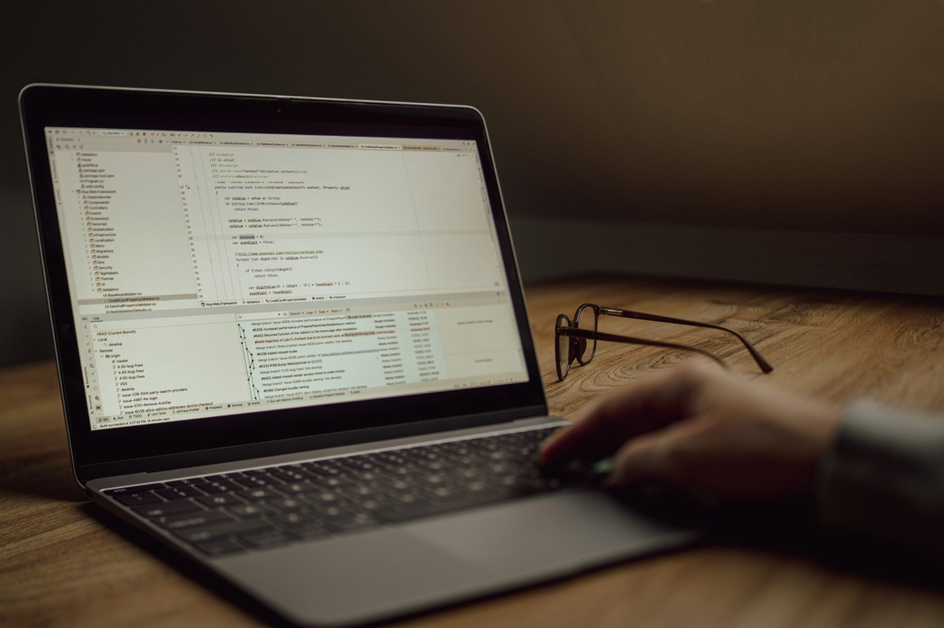 Developer writing code on a laptop