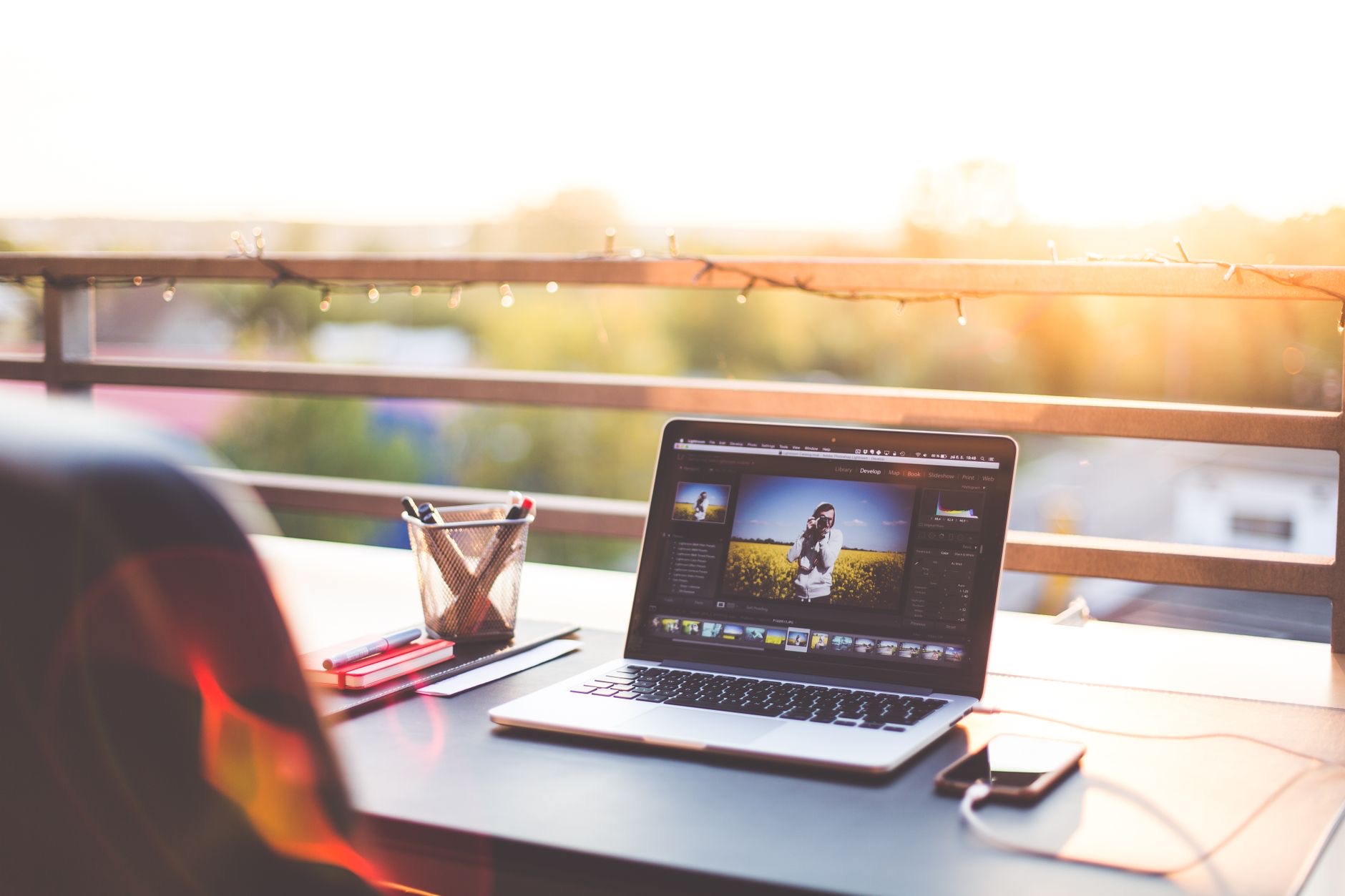 Creative workspace with a laptop and editing setup