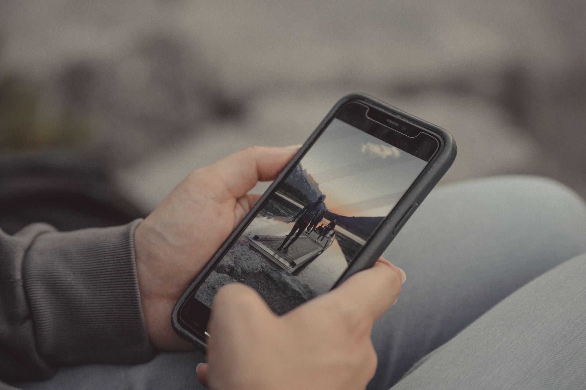 A smartphone held in a value buying guide