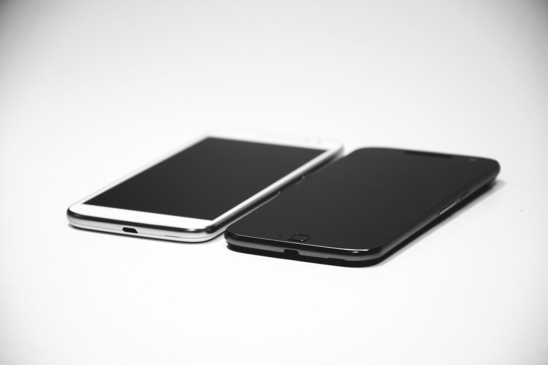 A smartphone surrounded by wireless devices