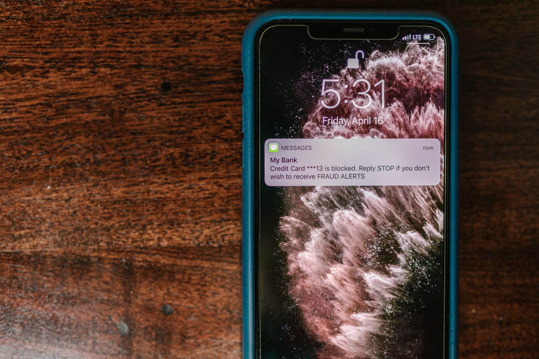 Close-up of a phone showing a warning message