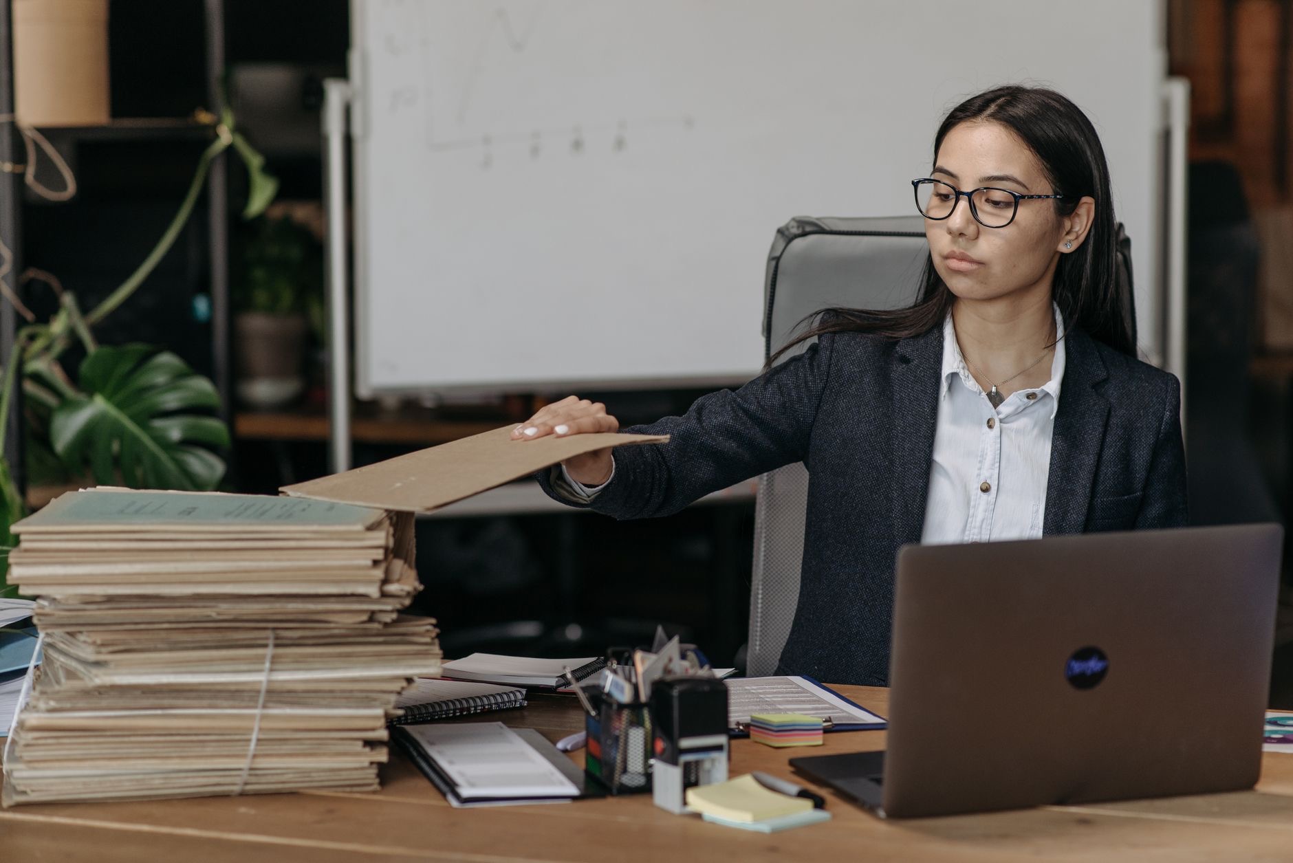 A person managing files on a laptop