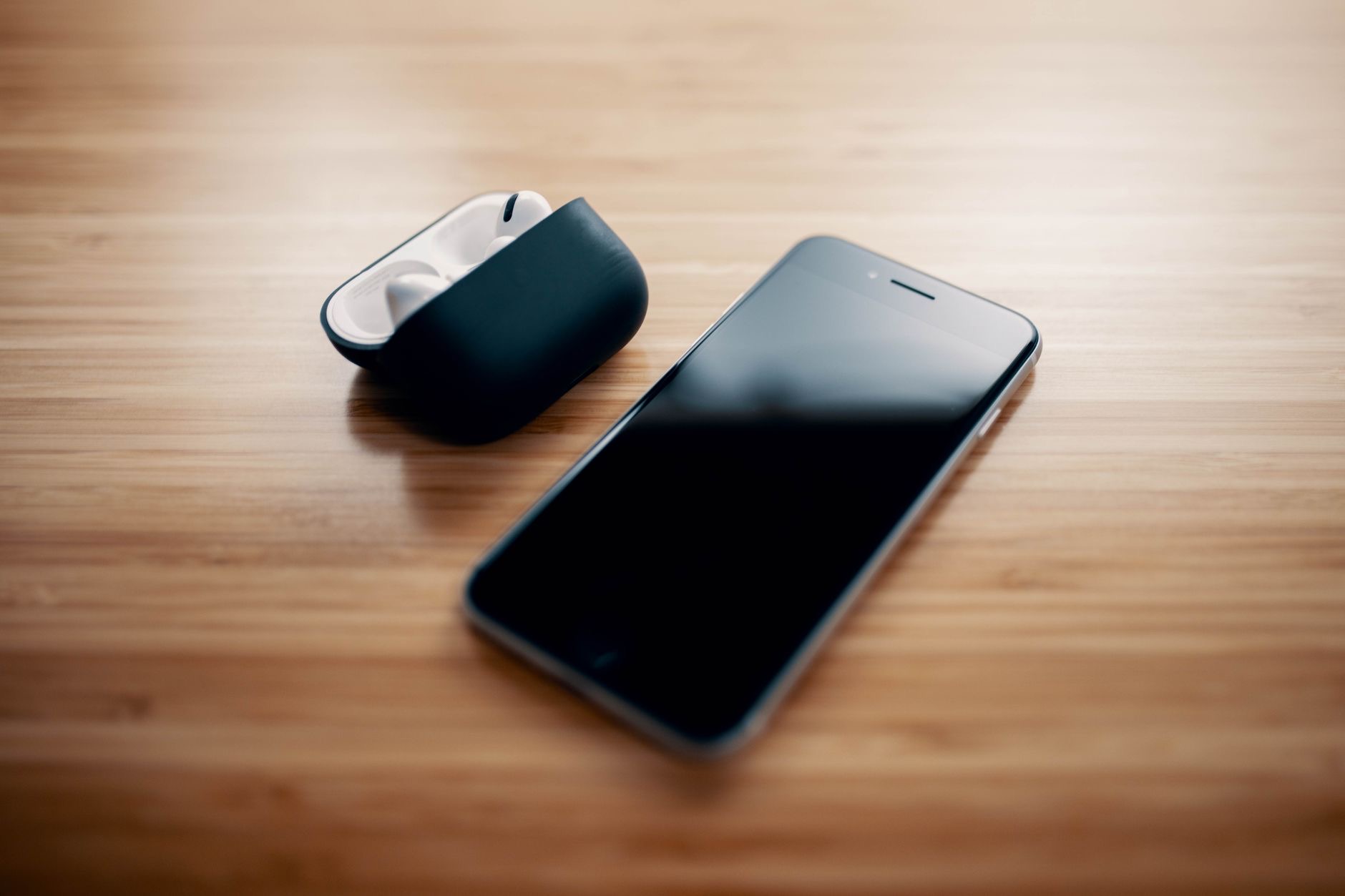 AirPods next to a smartphone ready to pair