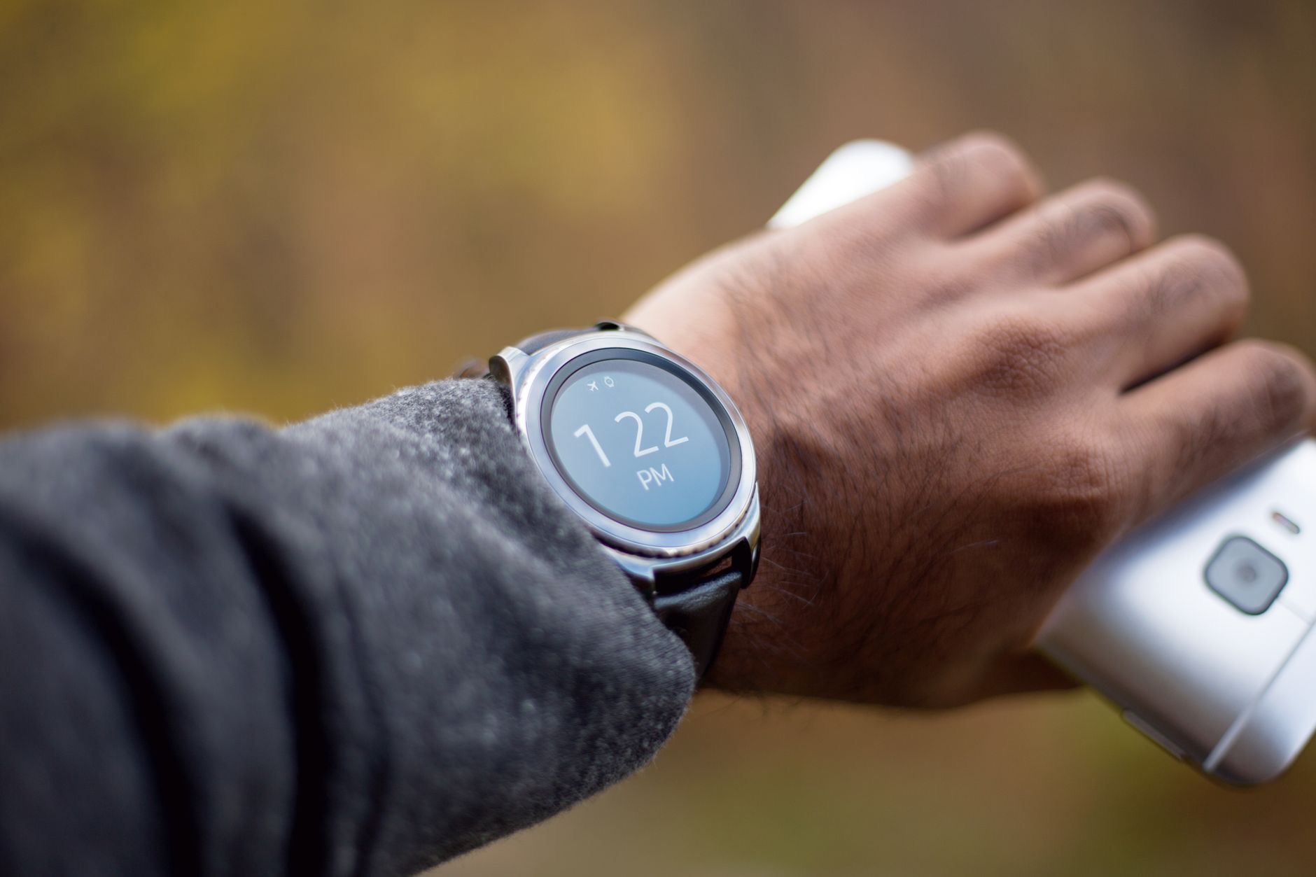 Person using a phone to set up a smartwatch