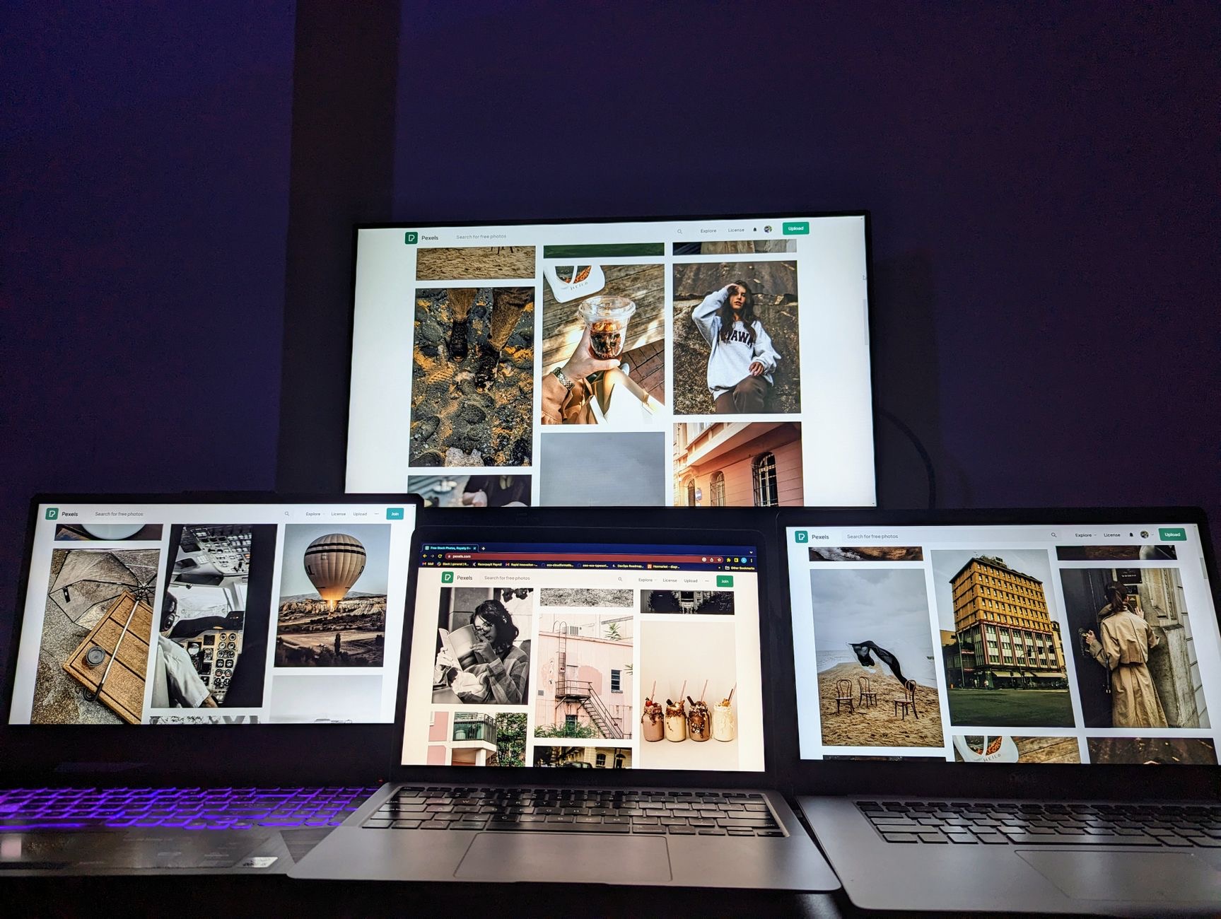 Laptop screen displaying a grid of imported photos