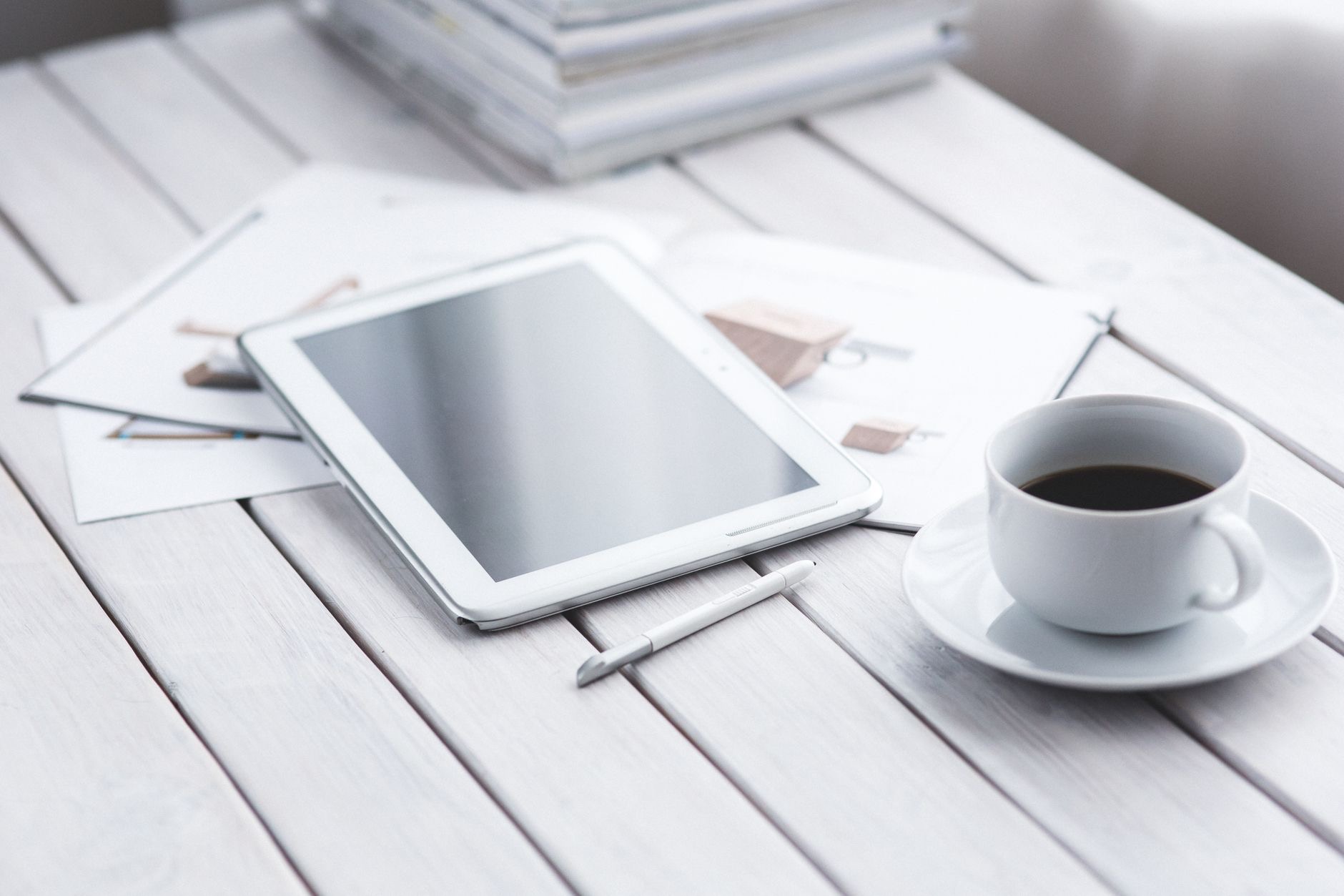 A tablet resting on a wooden surface