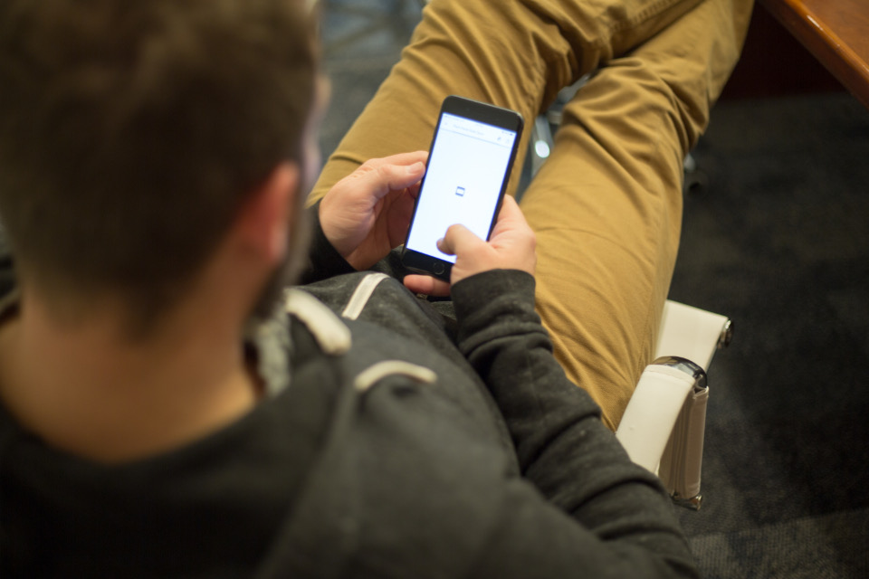 A person adjusting settings on a smartphone