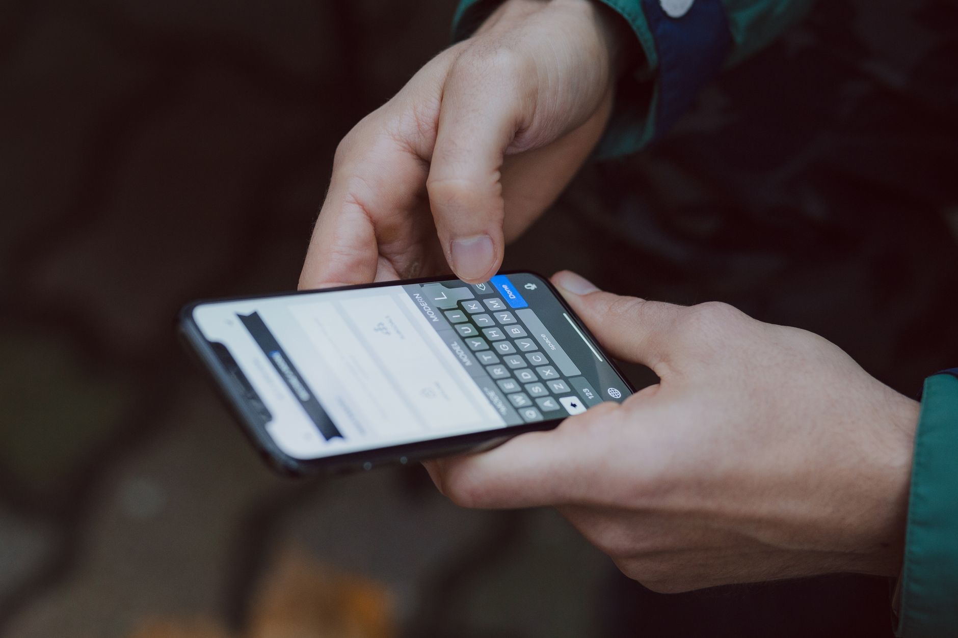A person adjusting Wi-Fi settings on a phone