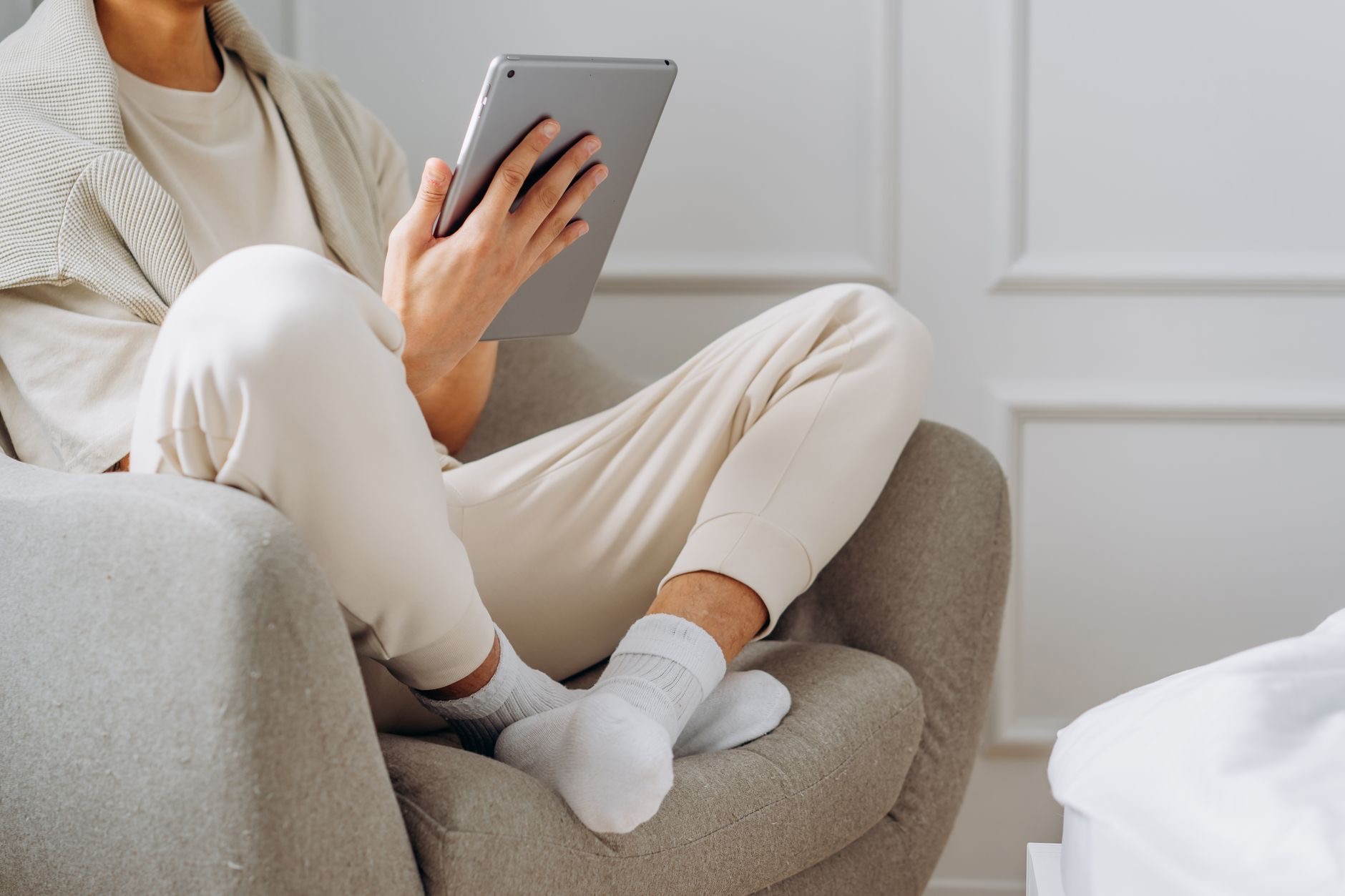 A person reading on a compact tablet