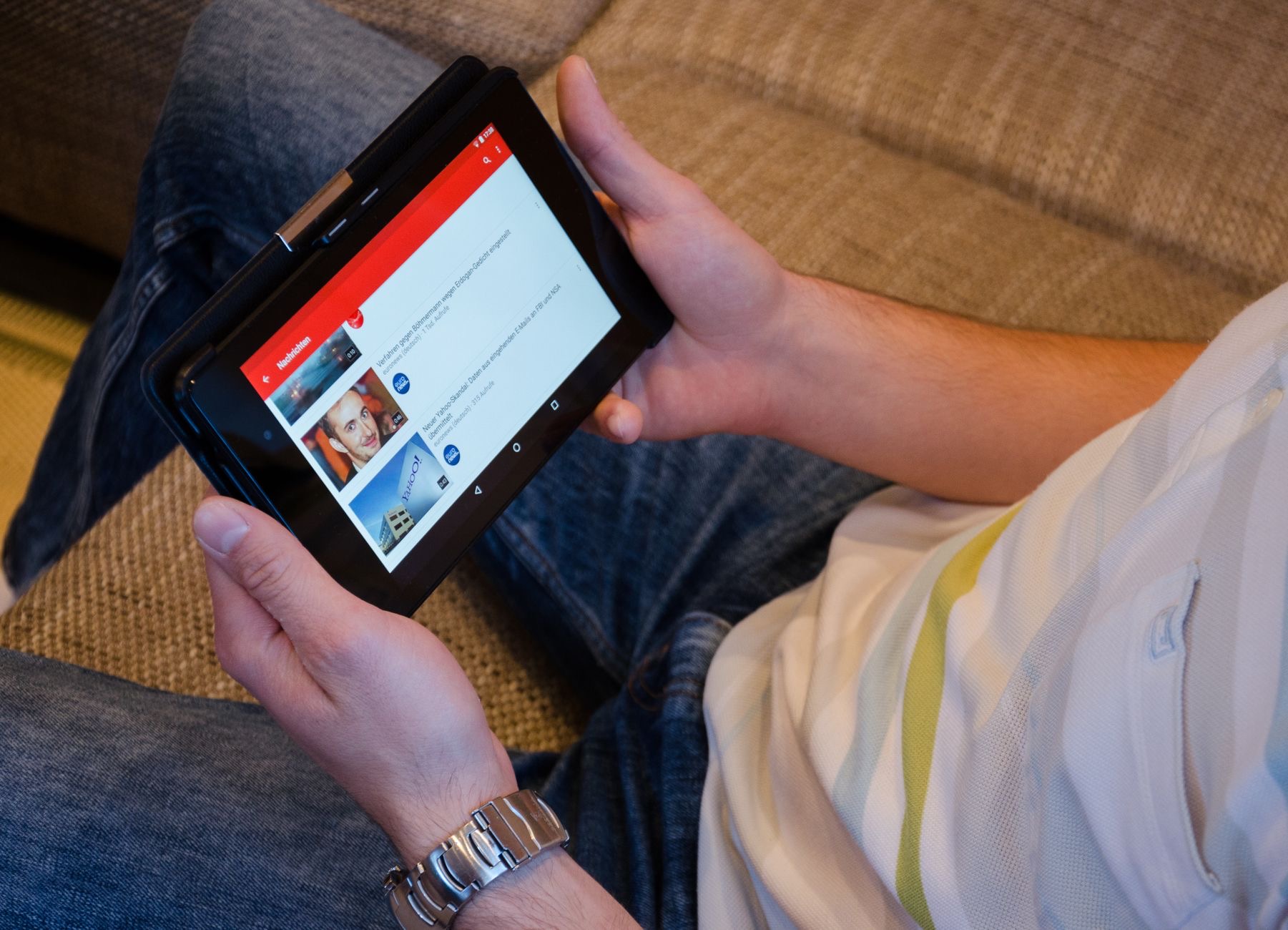 A person watching video on a tablet