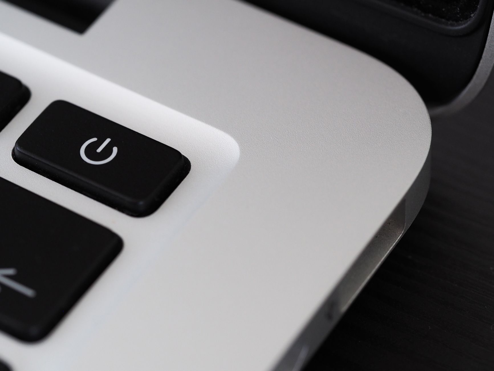 A laptop power button and keyboard
