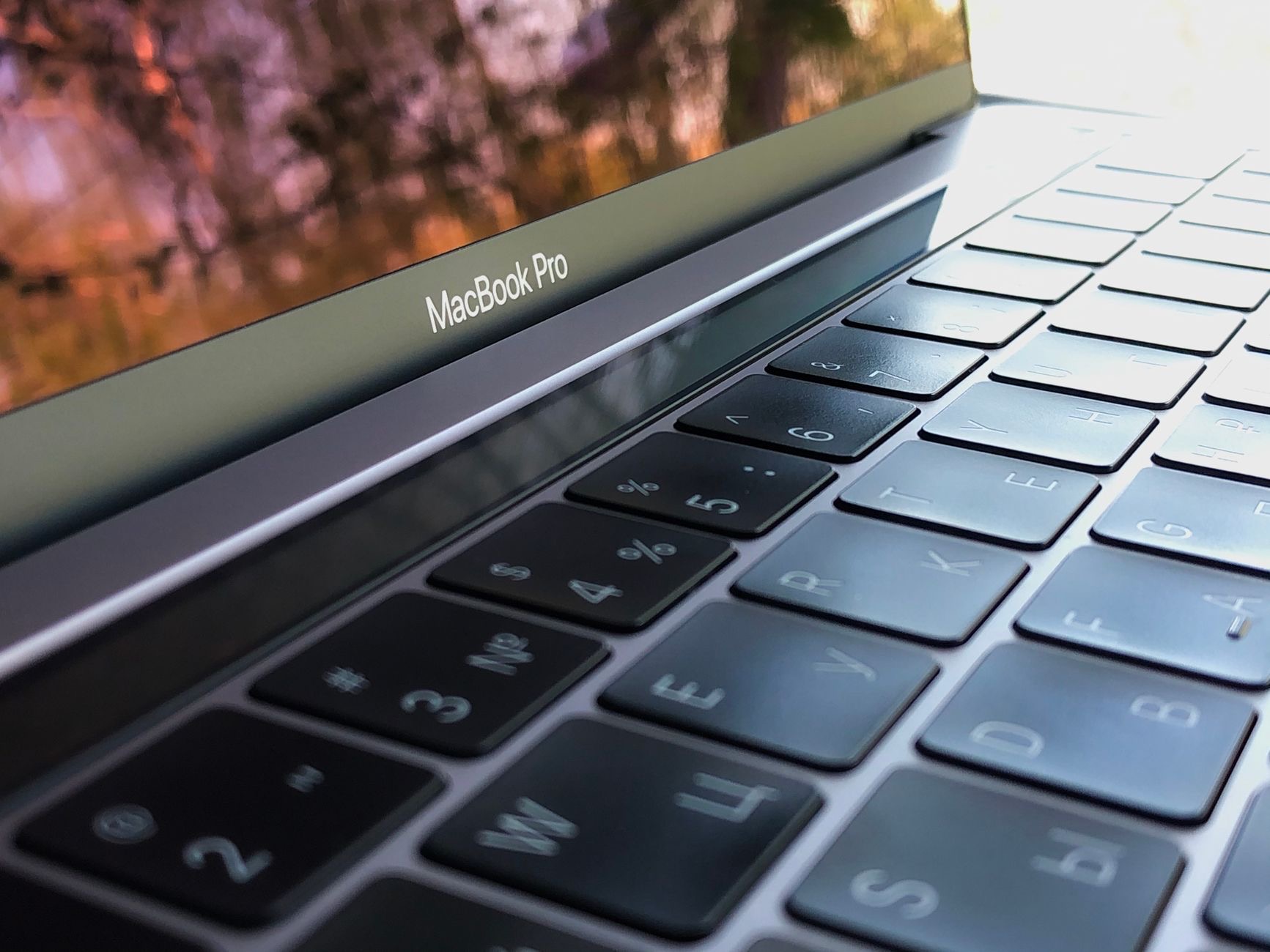 Close-up of a MacBook keyboard on a desk