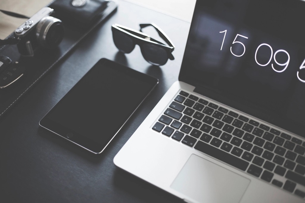 A laptop on a creative workspace desk