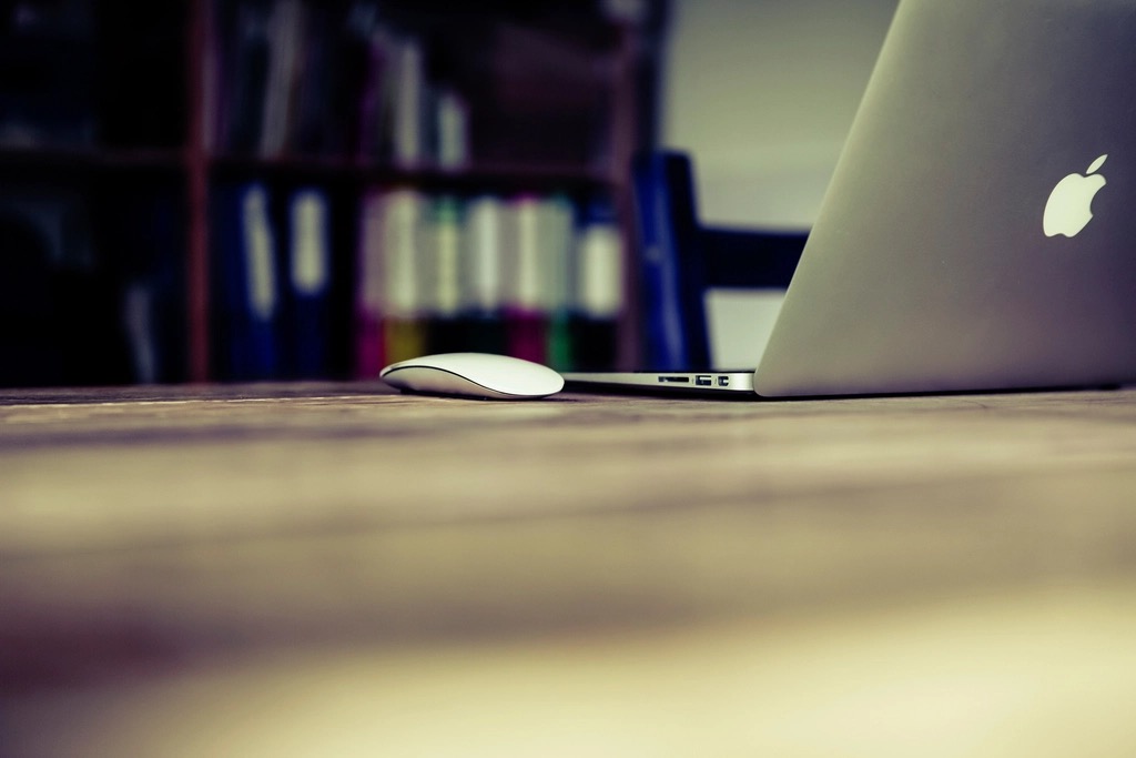 A MacBook laptop on a clean workspace