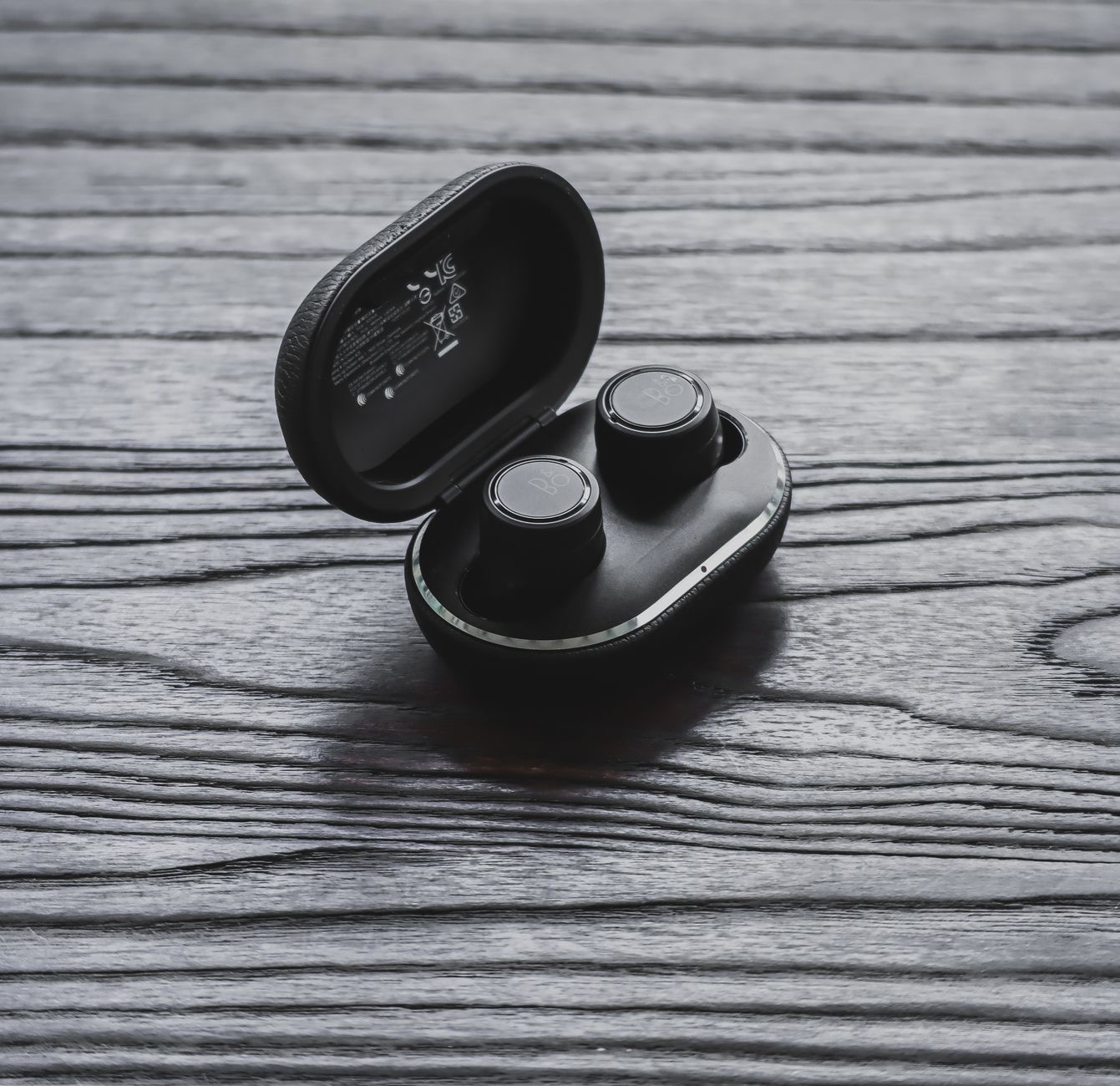 A close-up of wireless earbuds to spot a fake