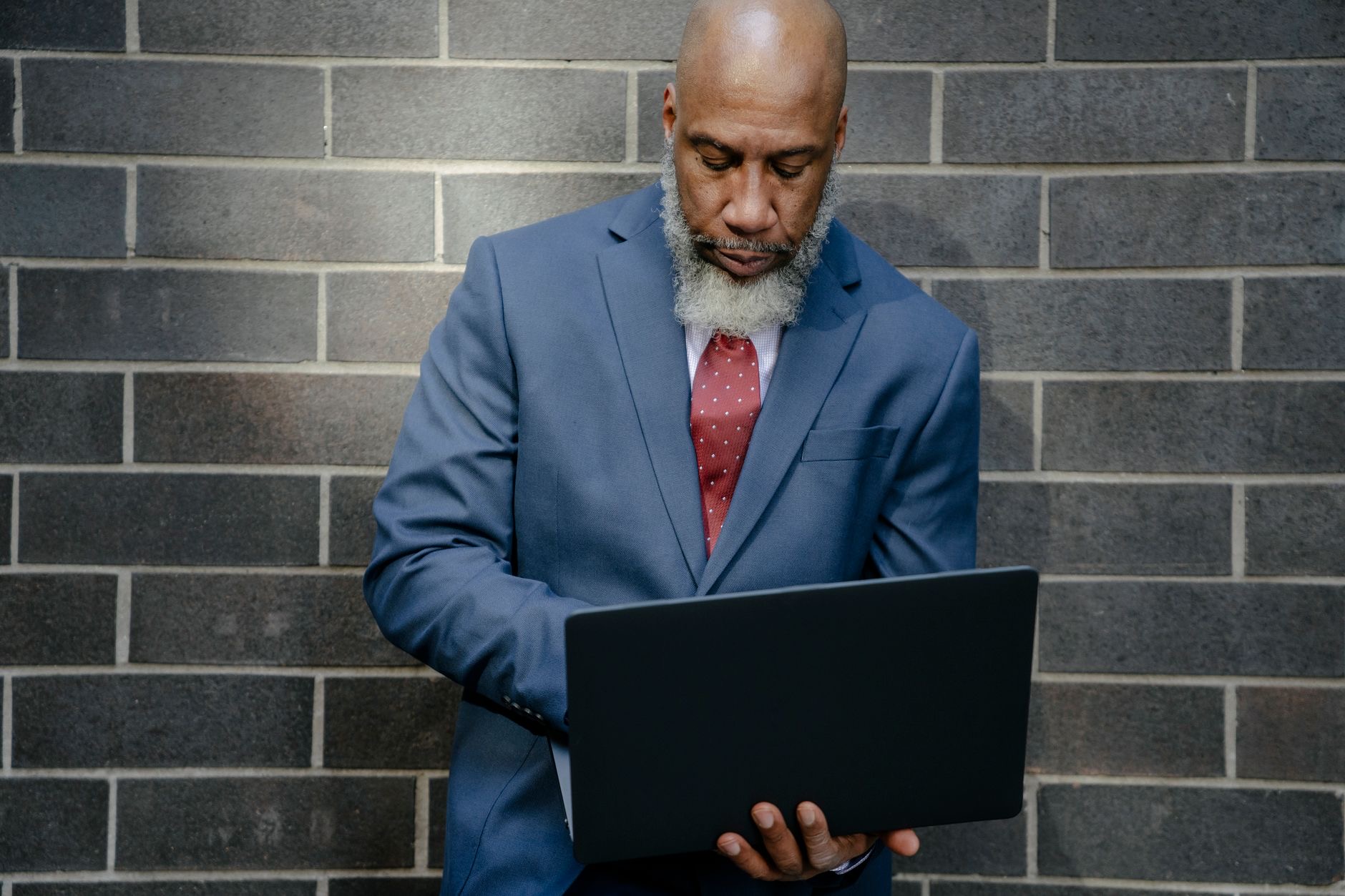 A person checking over a laptop