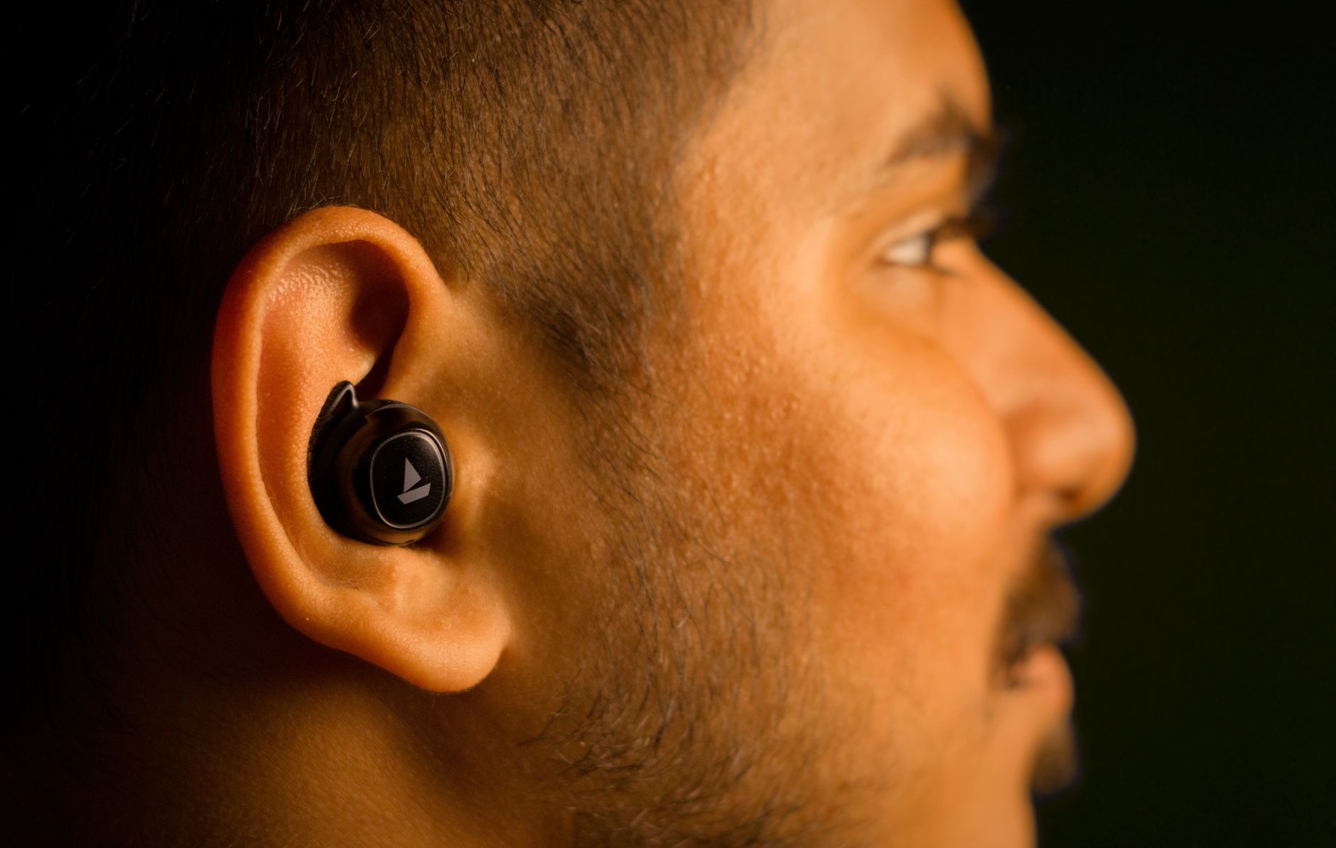 Person wearing wireless earbuds