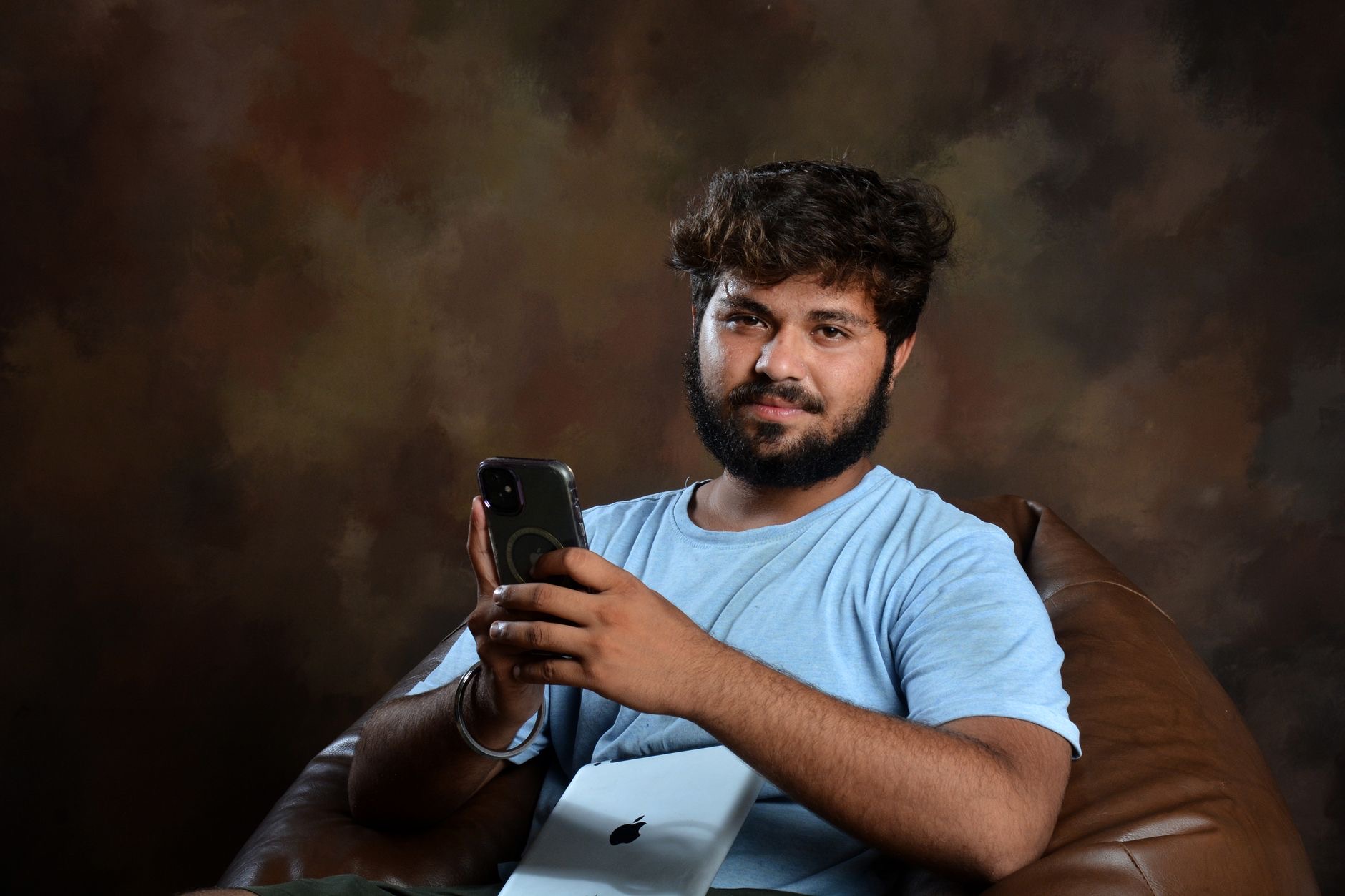 Person happily using an Apple device