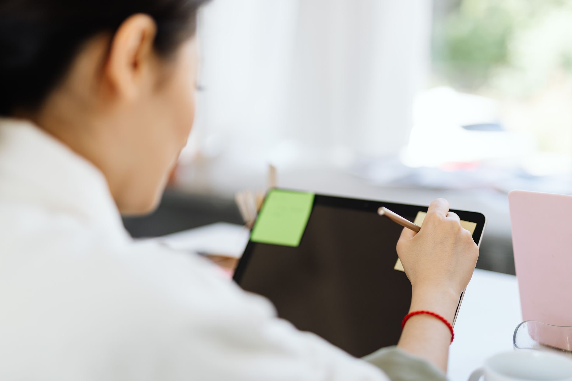 Close-up of a stylus taking notes