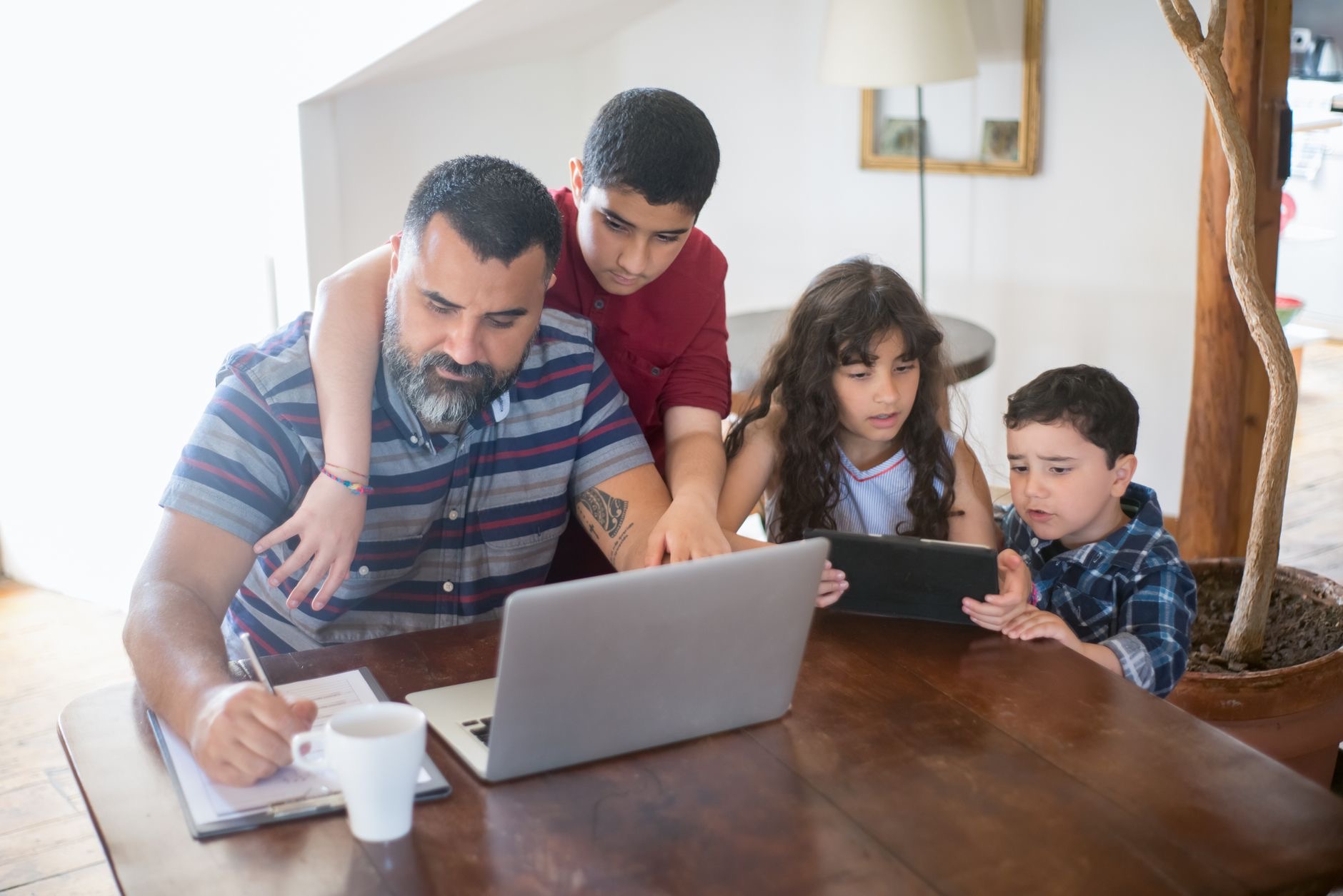 Family helping set up a tablet