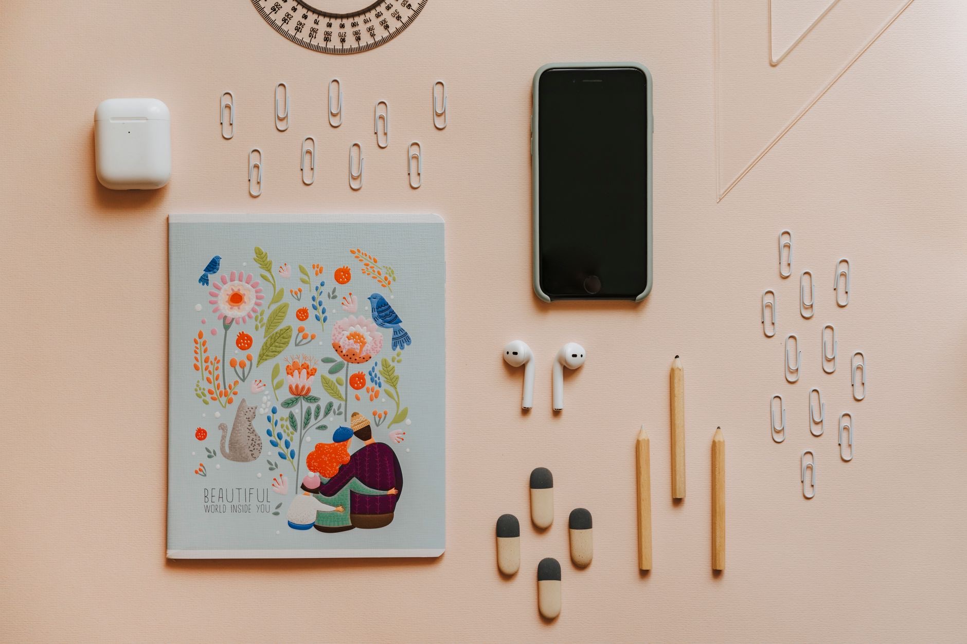 iPhone 16 with accessories laid out