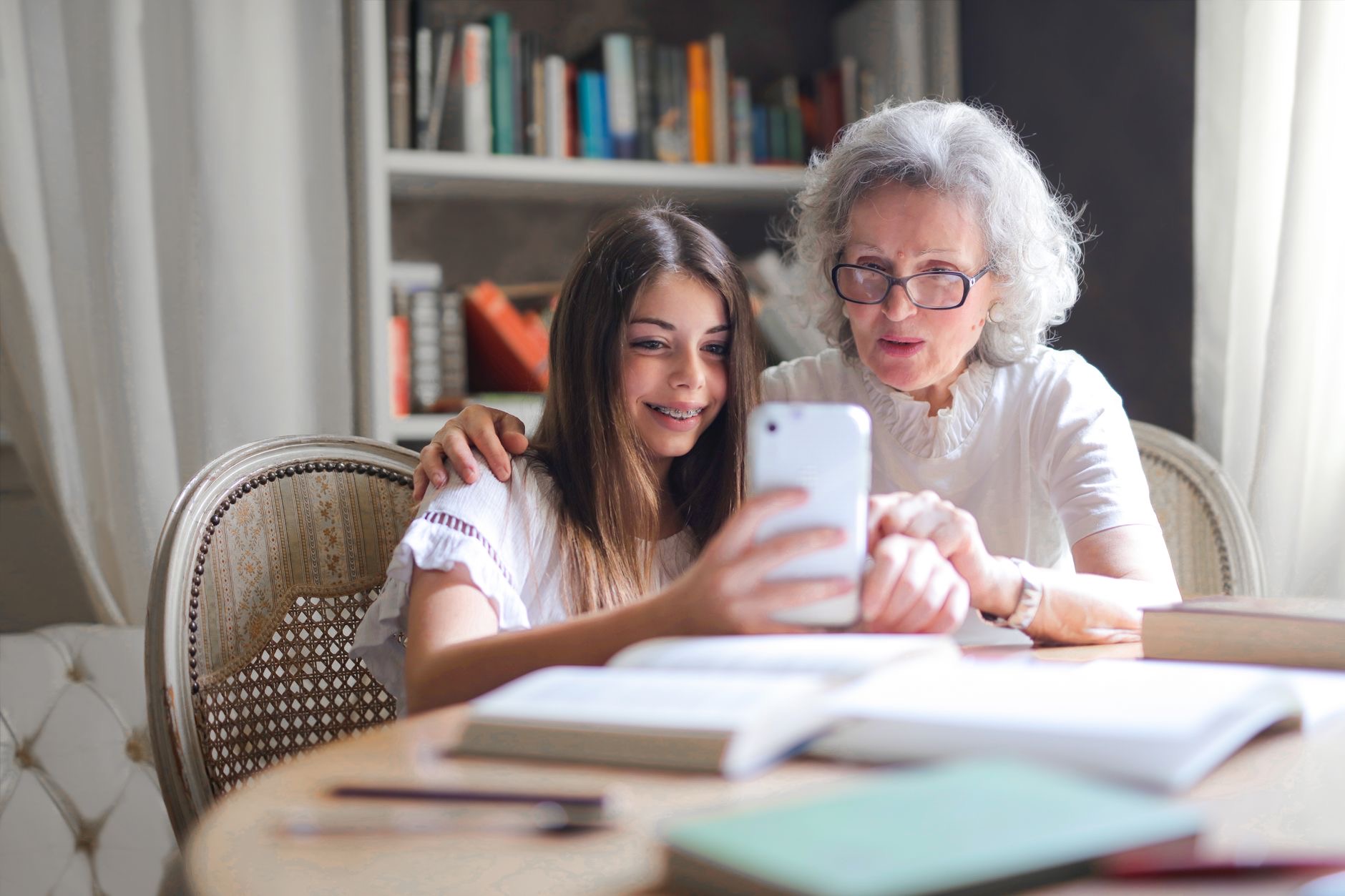 Parent and teen looking at a phone