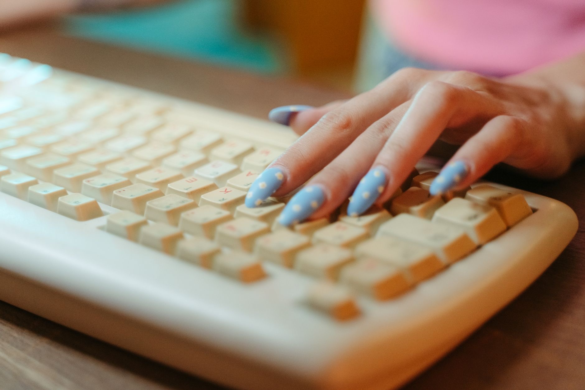 Close-up of hands typing on a keyboard