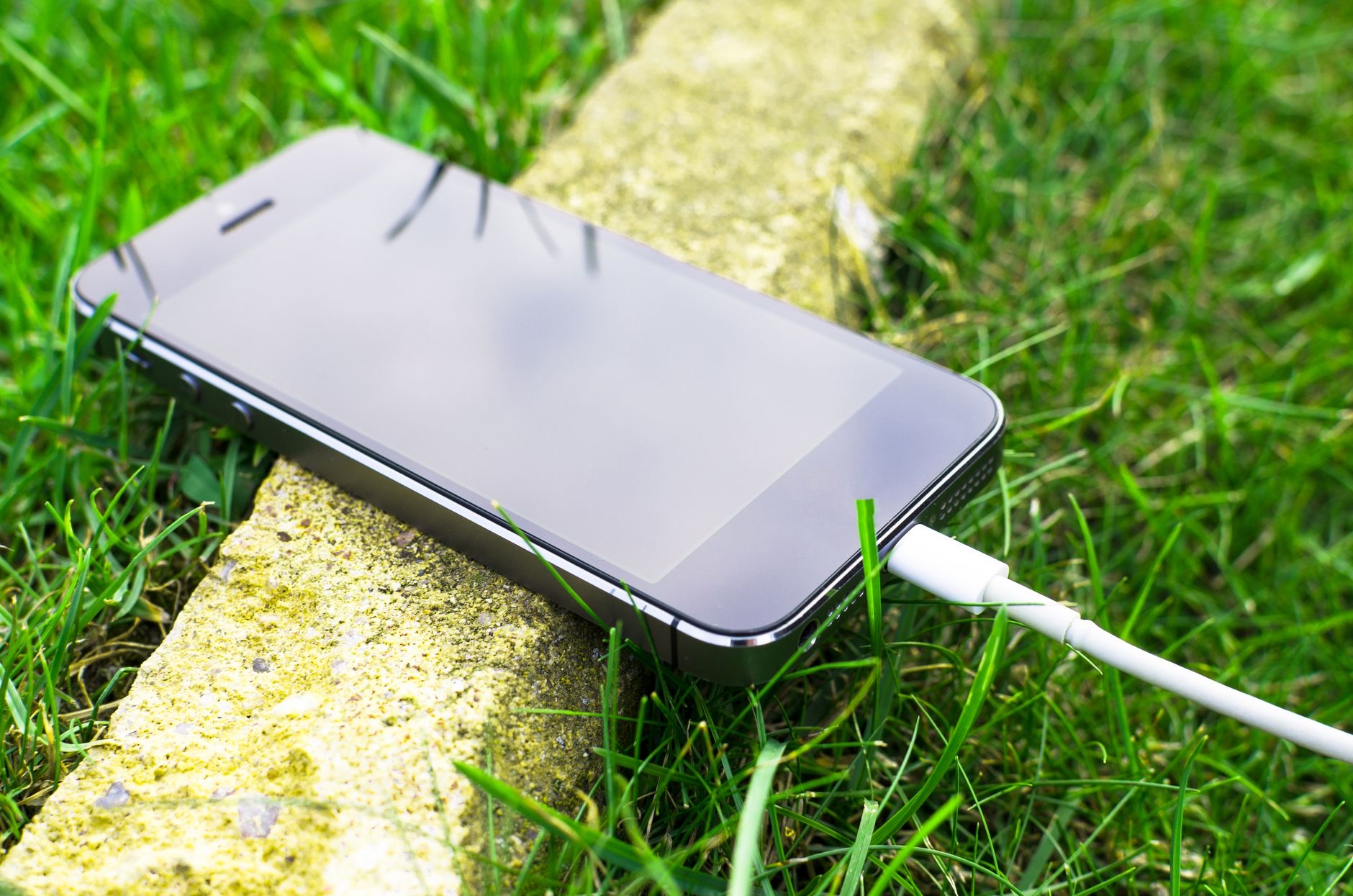 Person charging a phone on the go