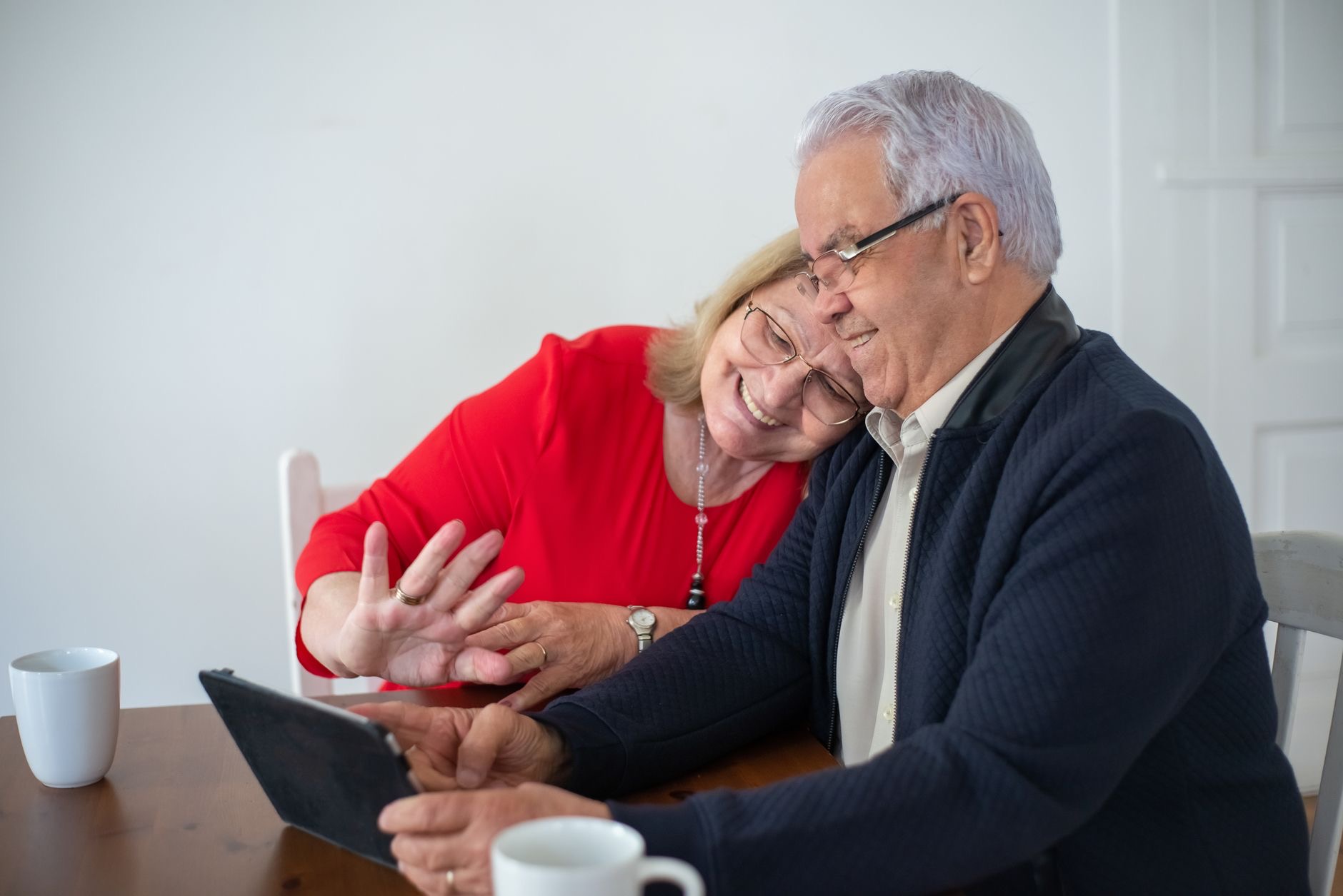 Parents on a video call with family