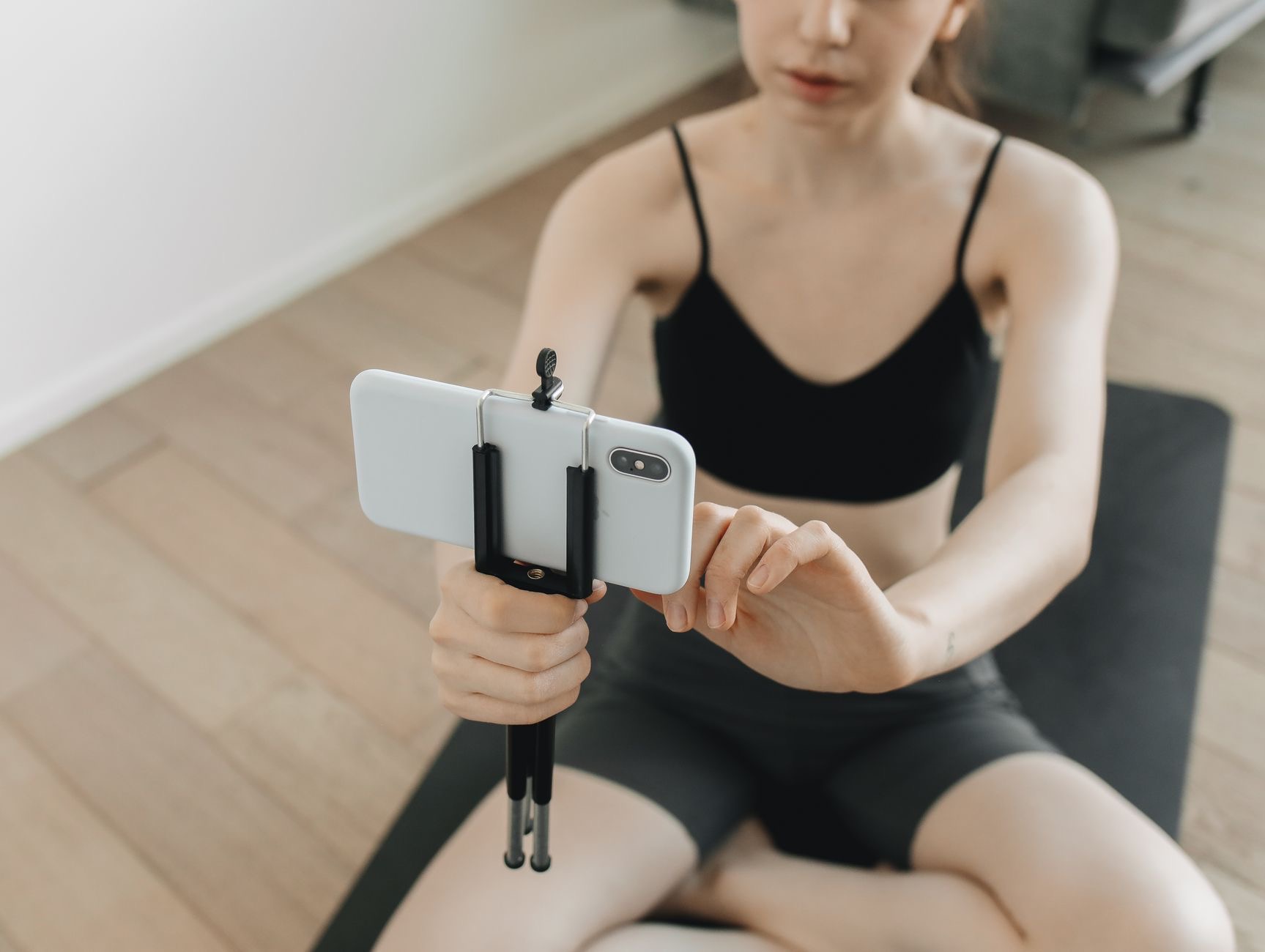 Person filming with a phone on a tripod