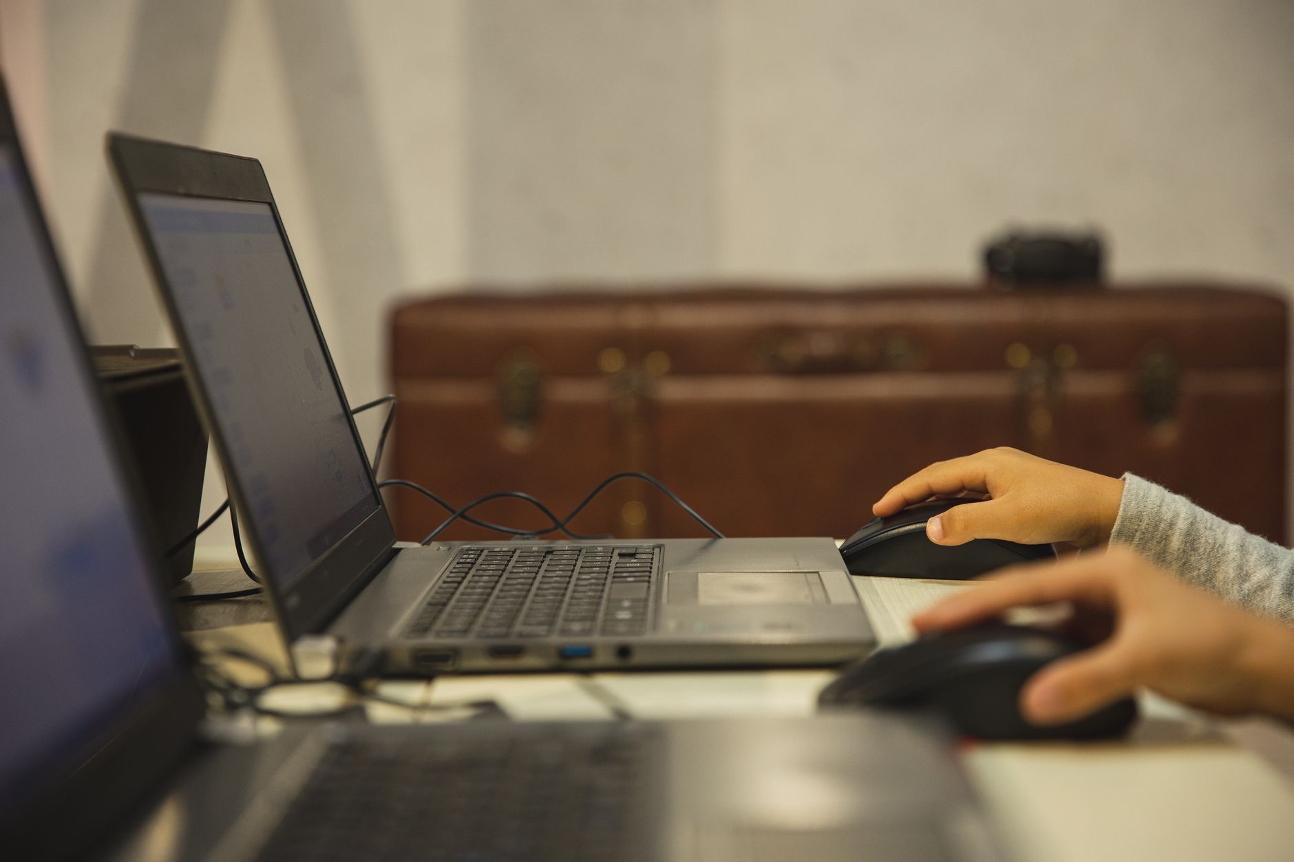 Close-up of a hand using a mouse