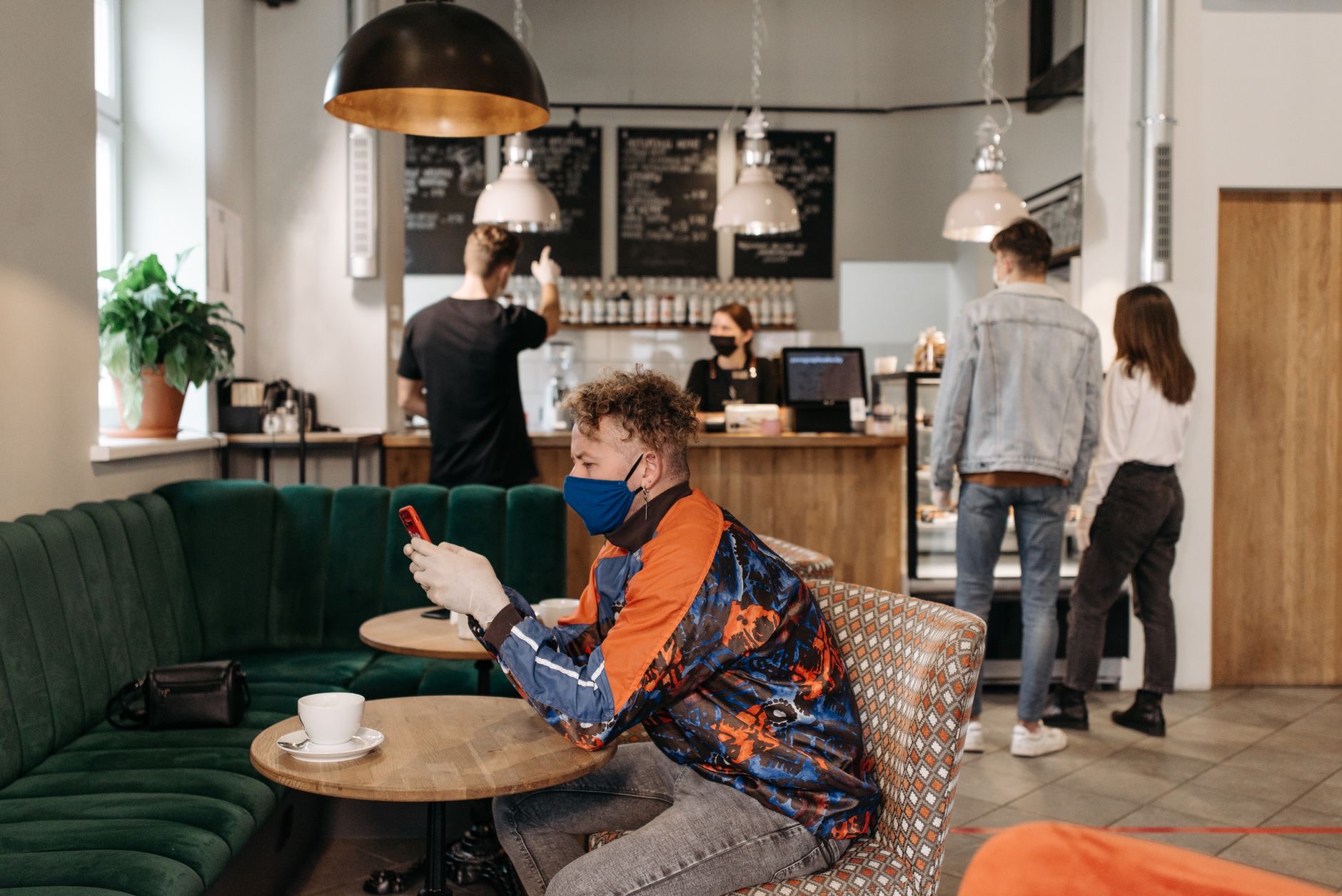 A person using an iPhone on public Wi-Fi
