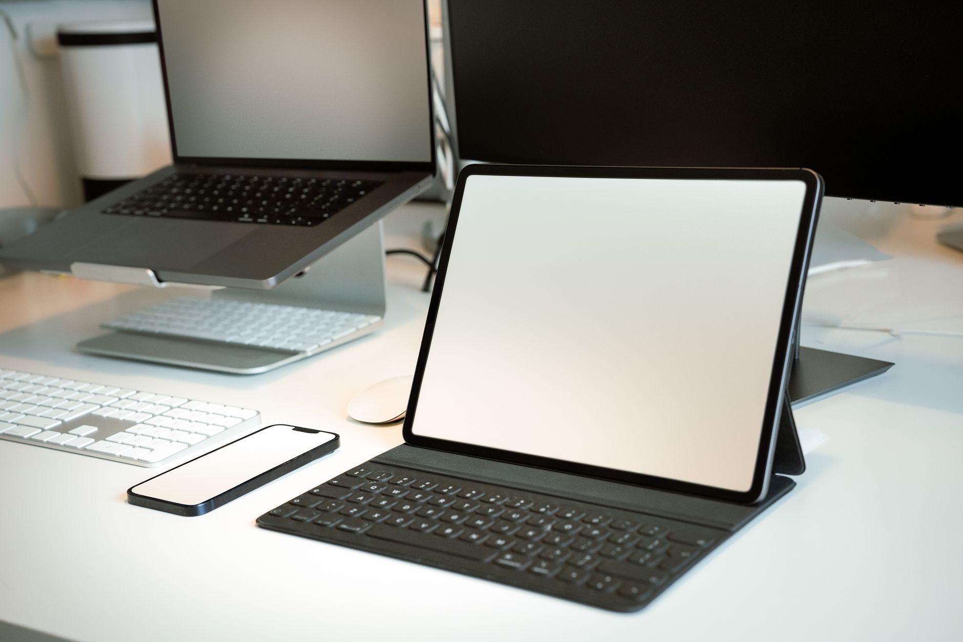 An iPad with a keyboard on a desk
