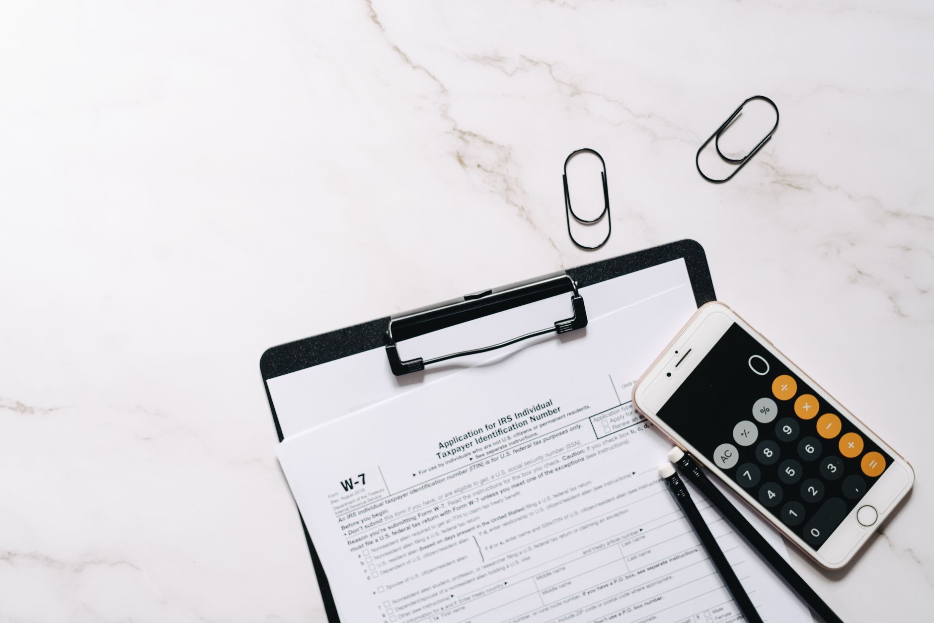 Close-up of a phone over a document