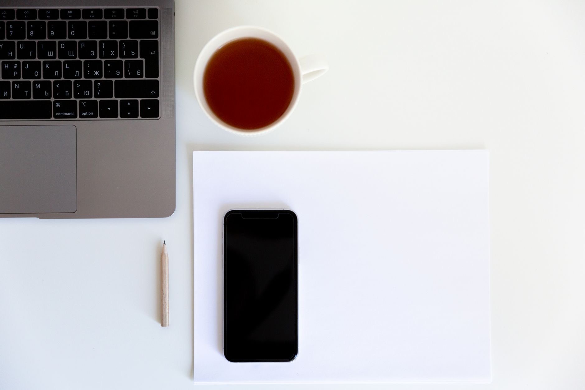 A phone with a document on a desk